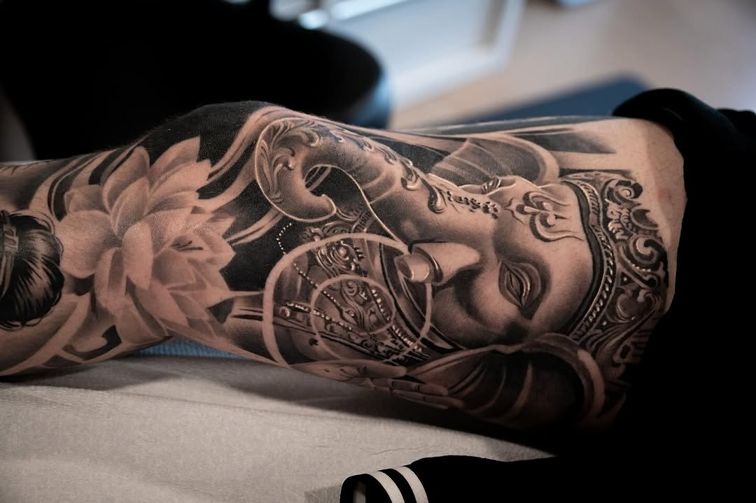 Ganesha and lotus Japanese tattoo on the forearm by Derek Hutchison, Des Moines, Iowa