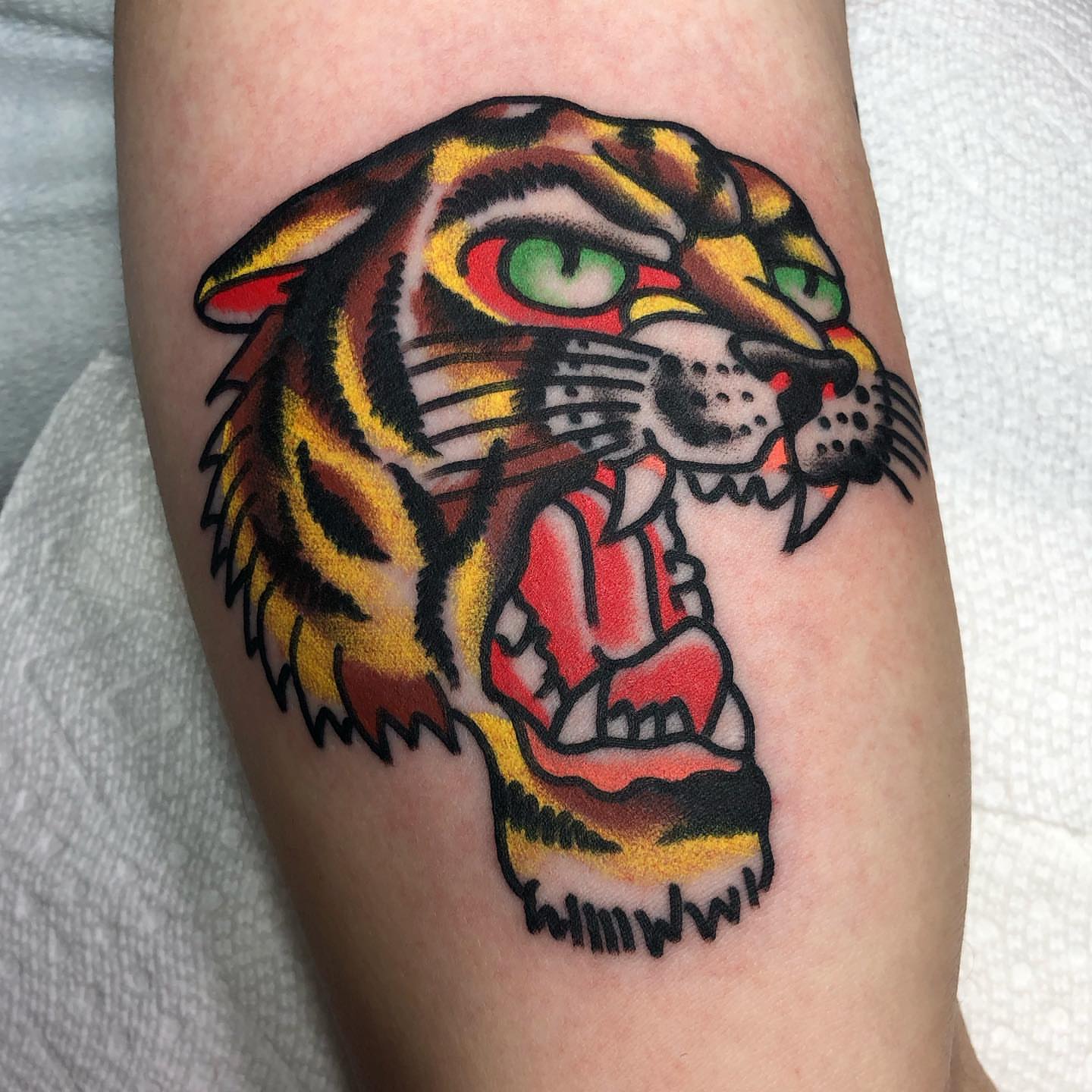 Tiger American traditional tattoo on the thigh by Tattoo