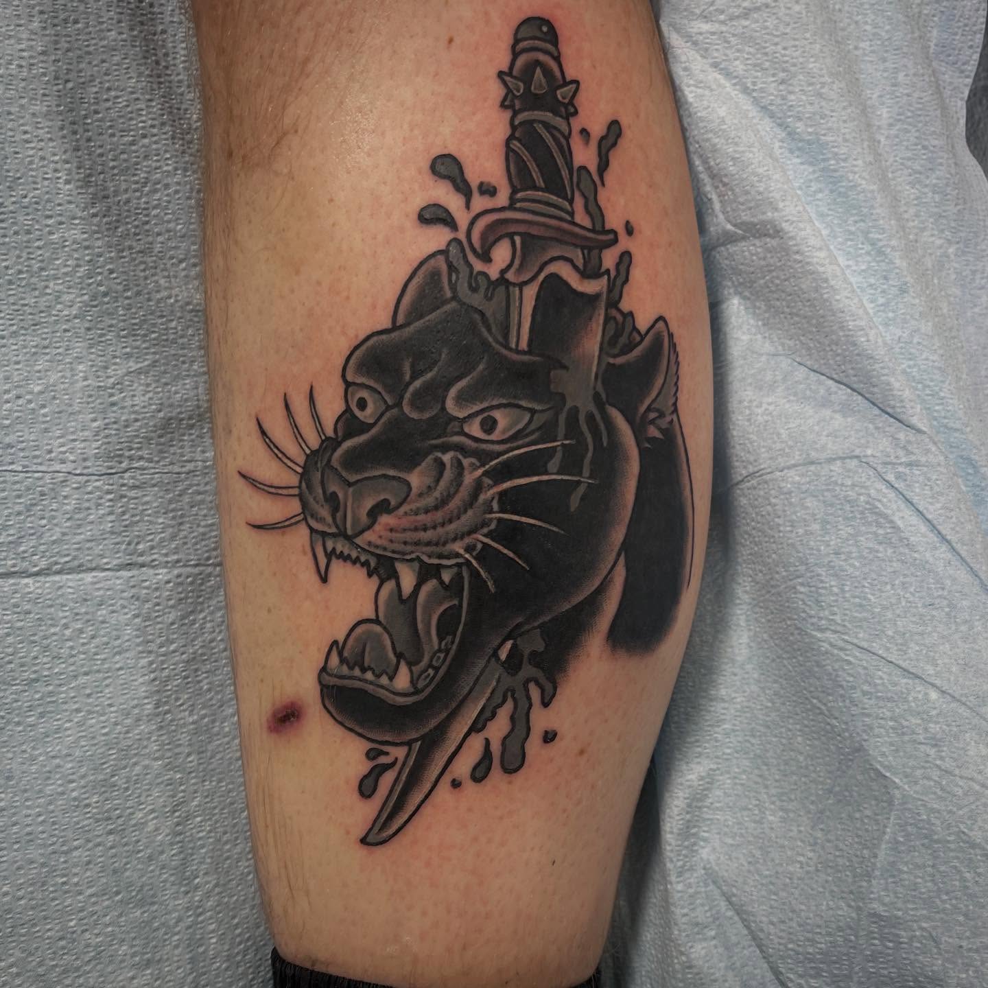 Panther and dagger realism tattoo on the forearm by Jaxson Eugene Brady-Hobart