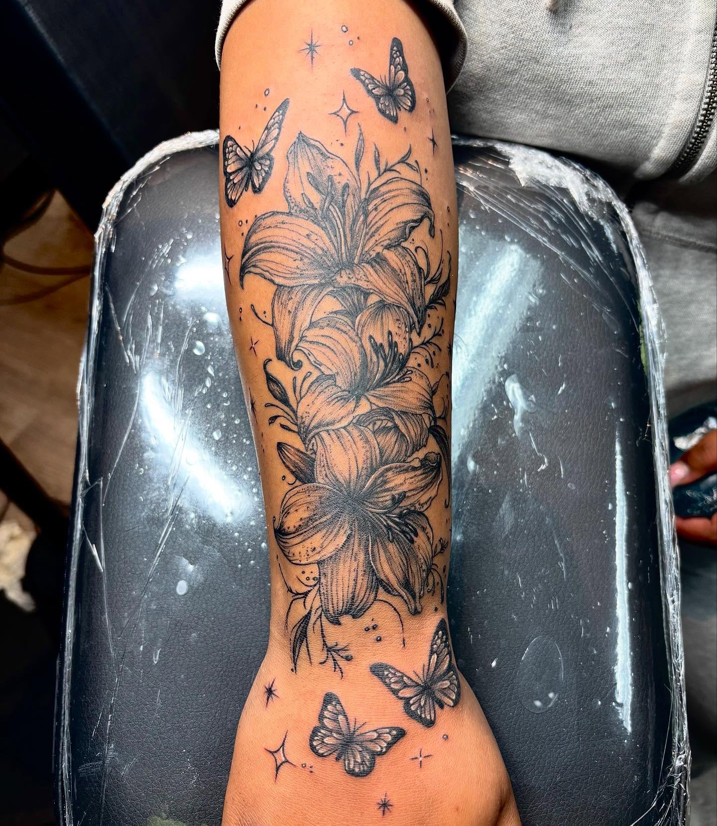 Lilies and butterflies realism tattoo on the forearm by ππππππ