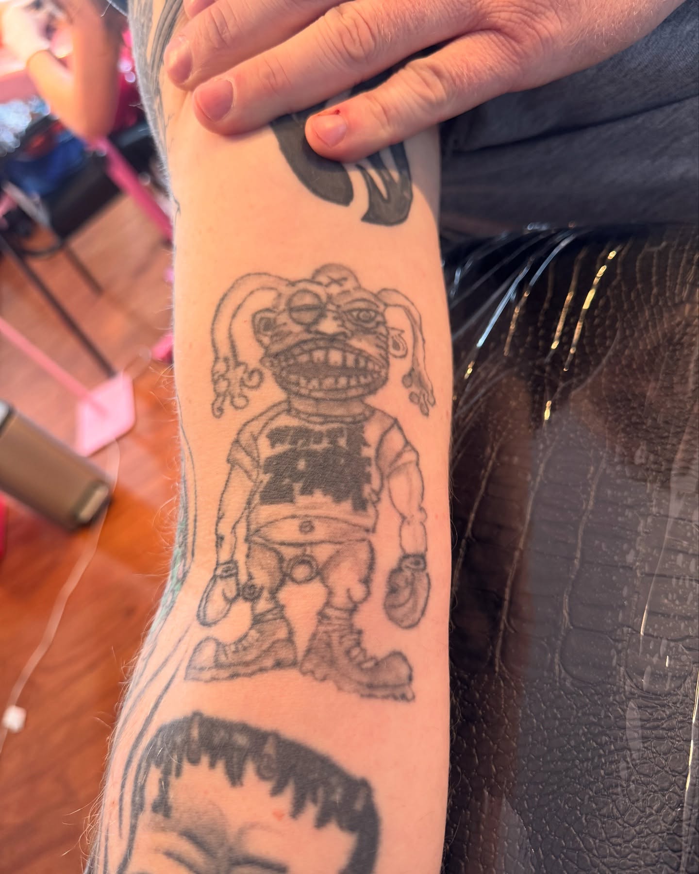 Alien figure black and grey tattoo on the forearm by juice🕷tattoo artist