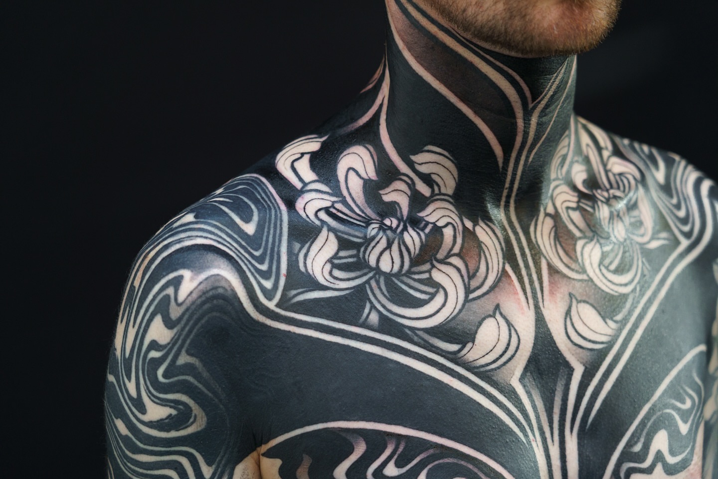 Floral design black and grey tattoo on the torso by Katie Mizuno, Berkeley, California