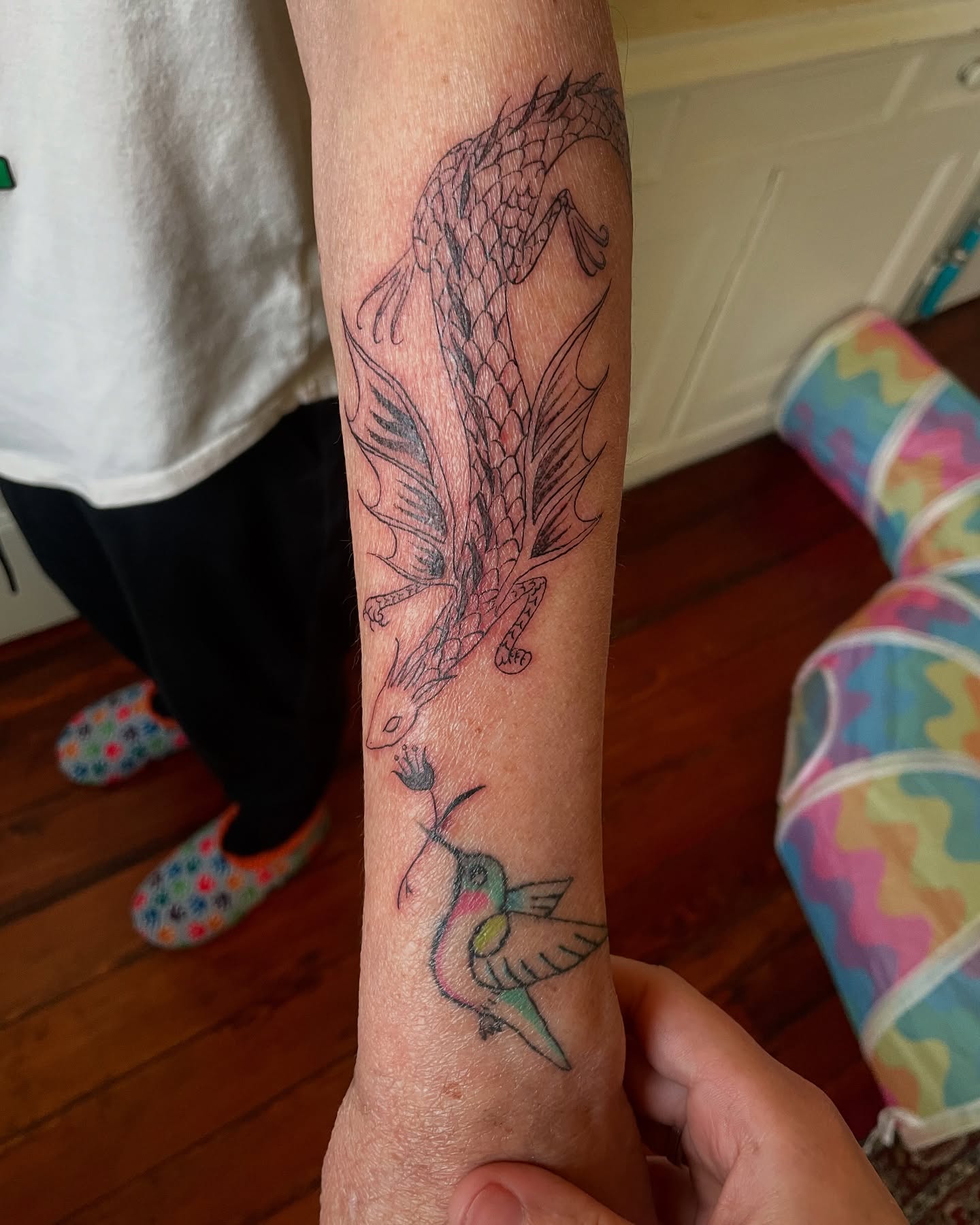 Phoenix and hummingbird neo-traditional tattoo on the forearm by Steph Liebetreu