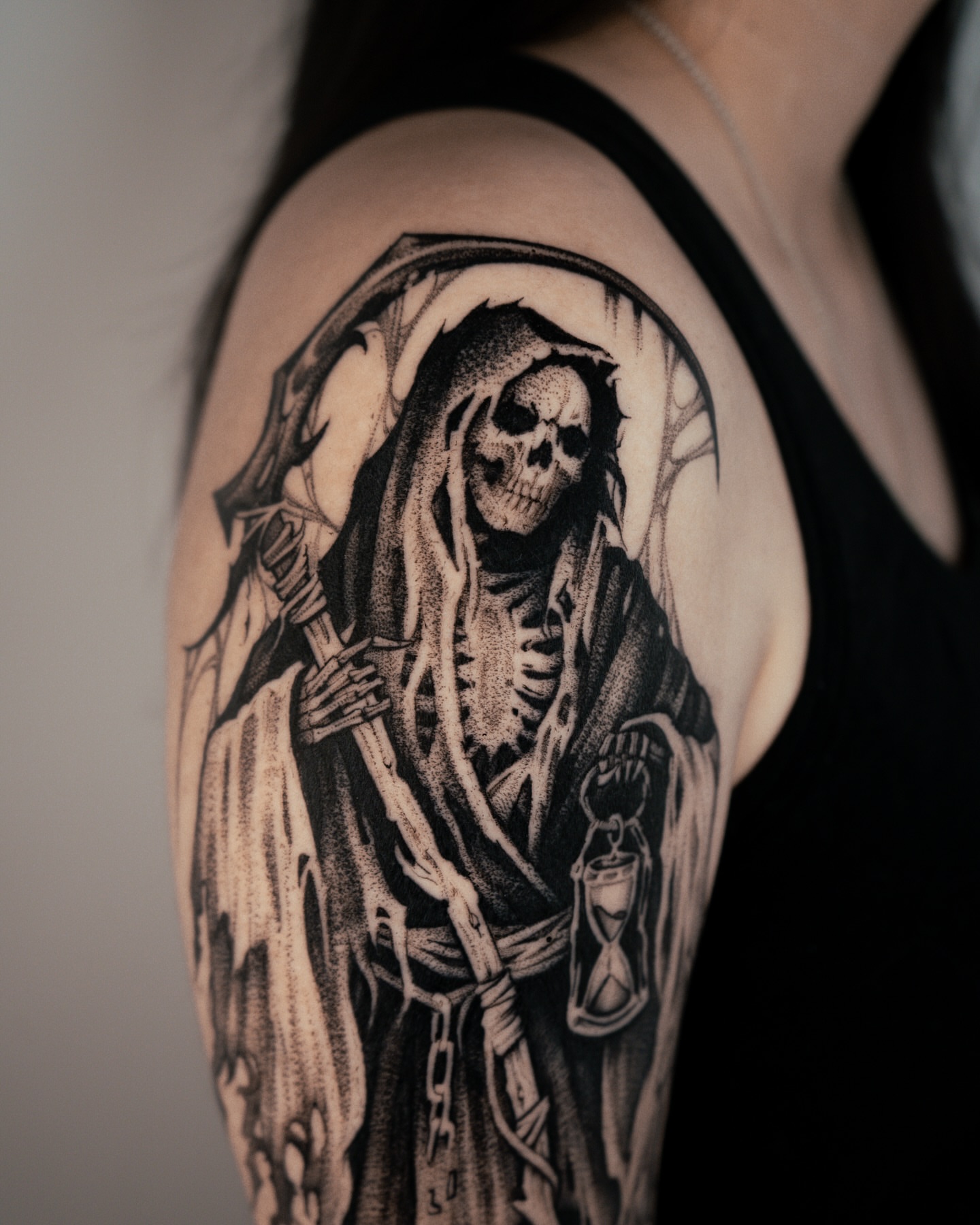 Grim reaper dotwork tattoo on the shoulder by Bruna Bianculli