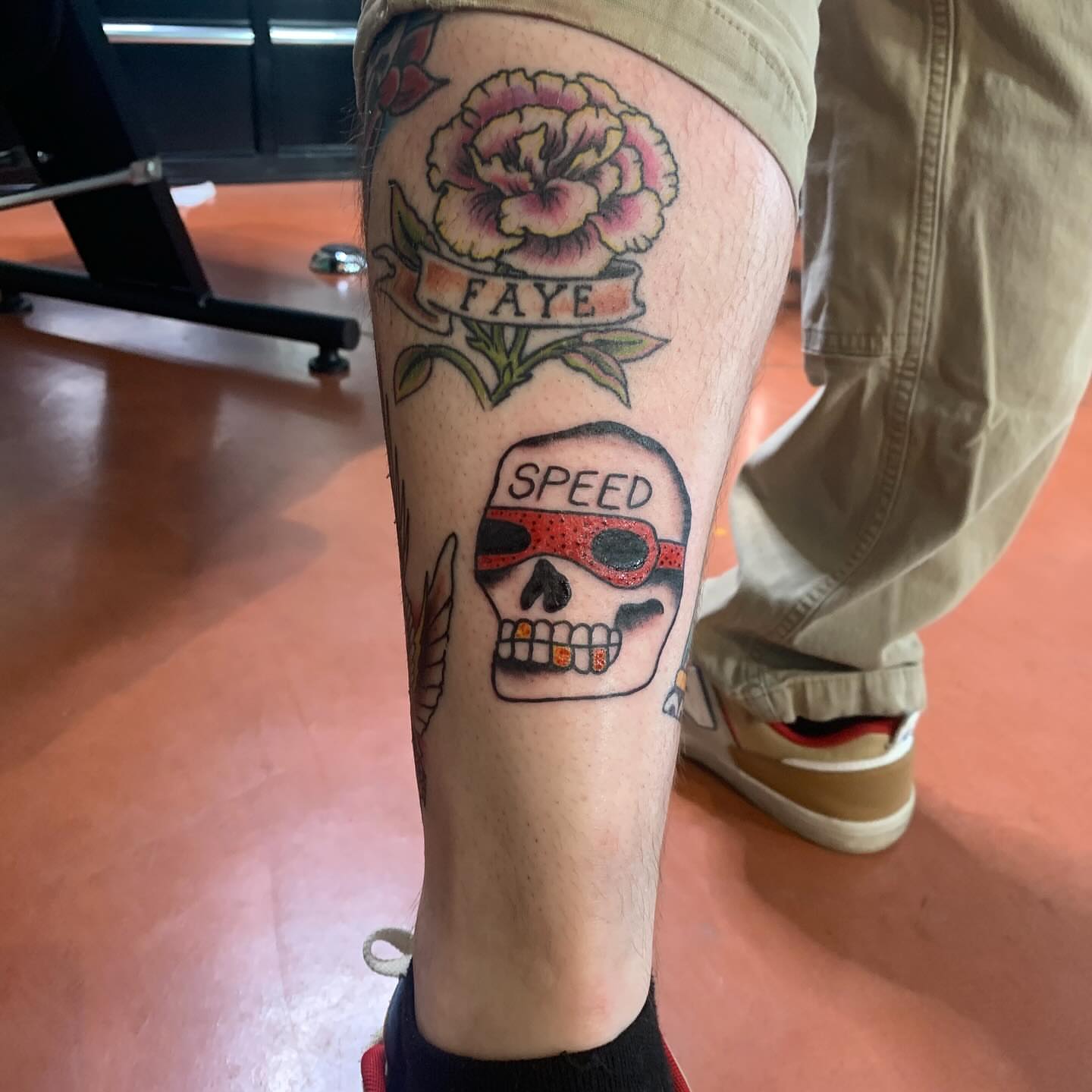 Skull with sunglasses American traditional tattoo on the calf by ellie