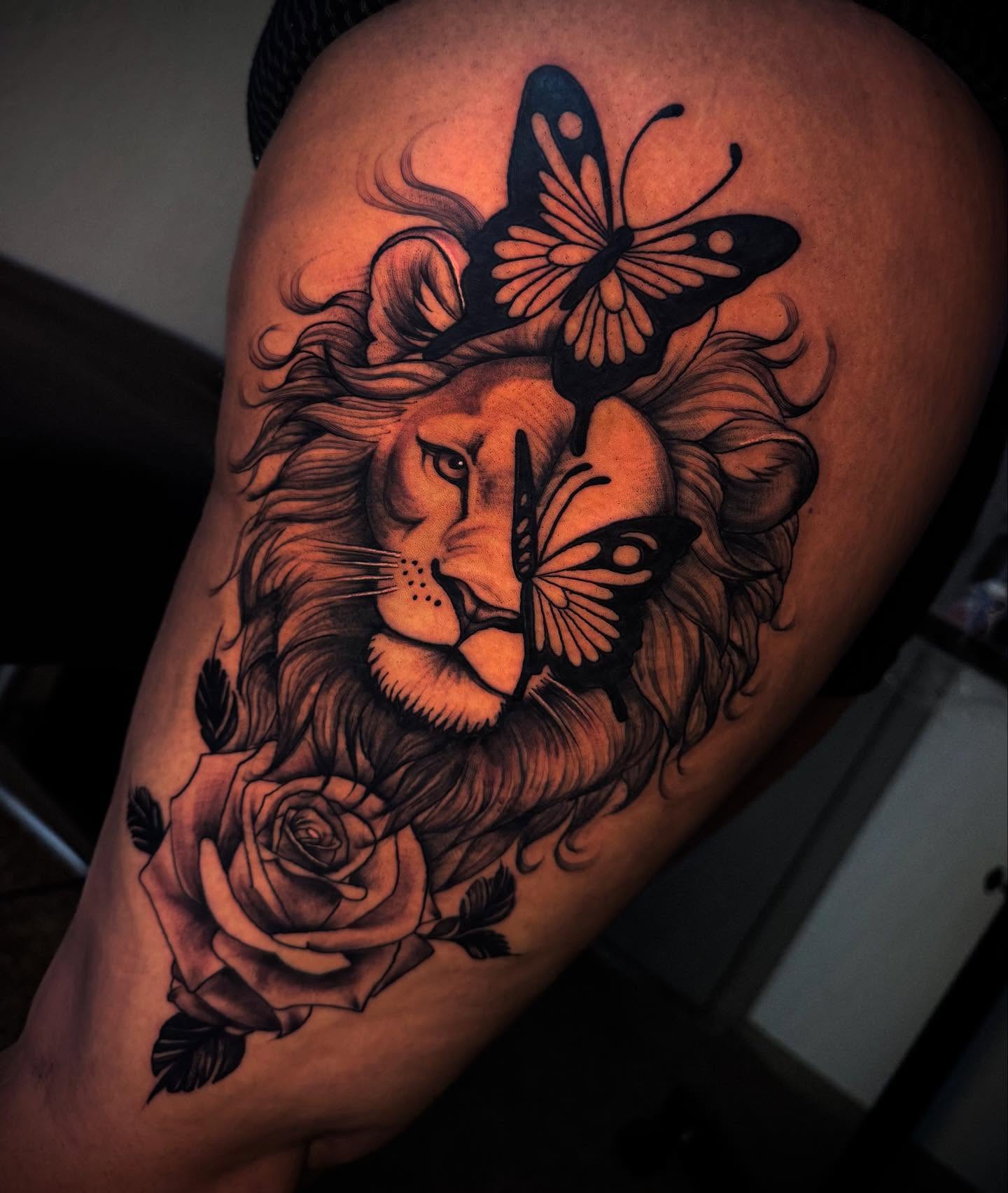 Lion and butterflies realism tattoo on the thigh by Tattoo Artist based in Dallas Tx