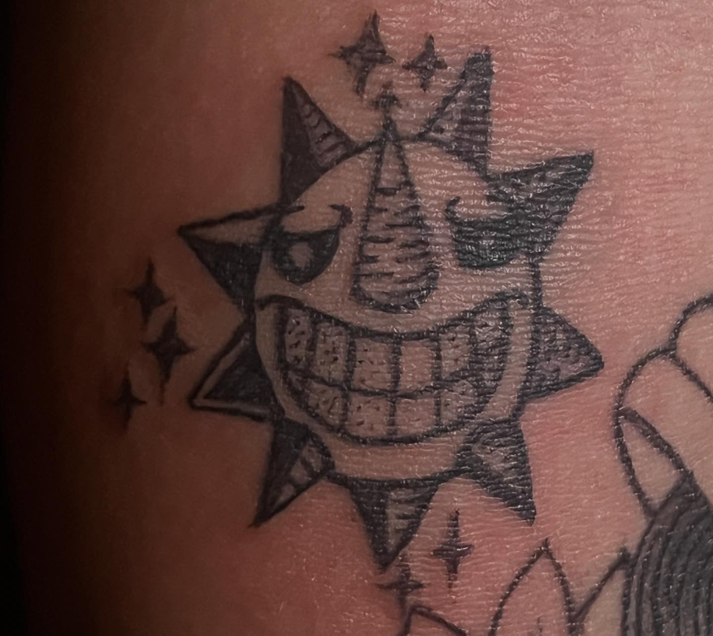 Sun with face black and grey tattoo on the forearm by Ink_ Hustle36