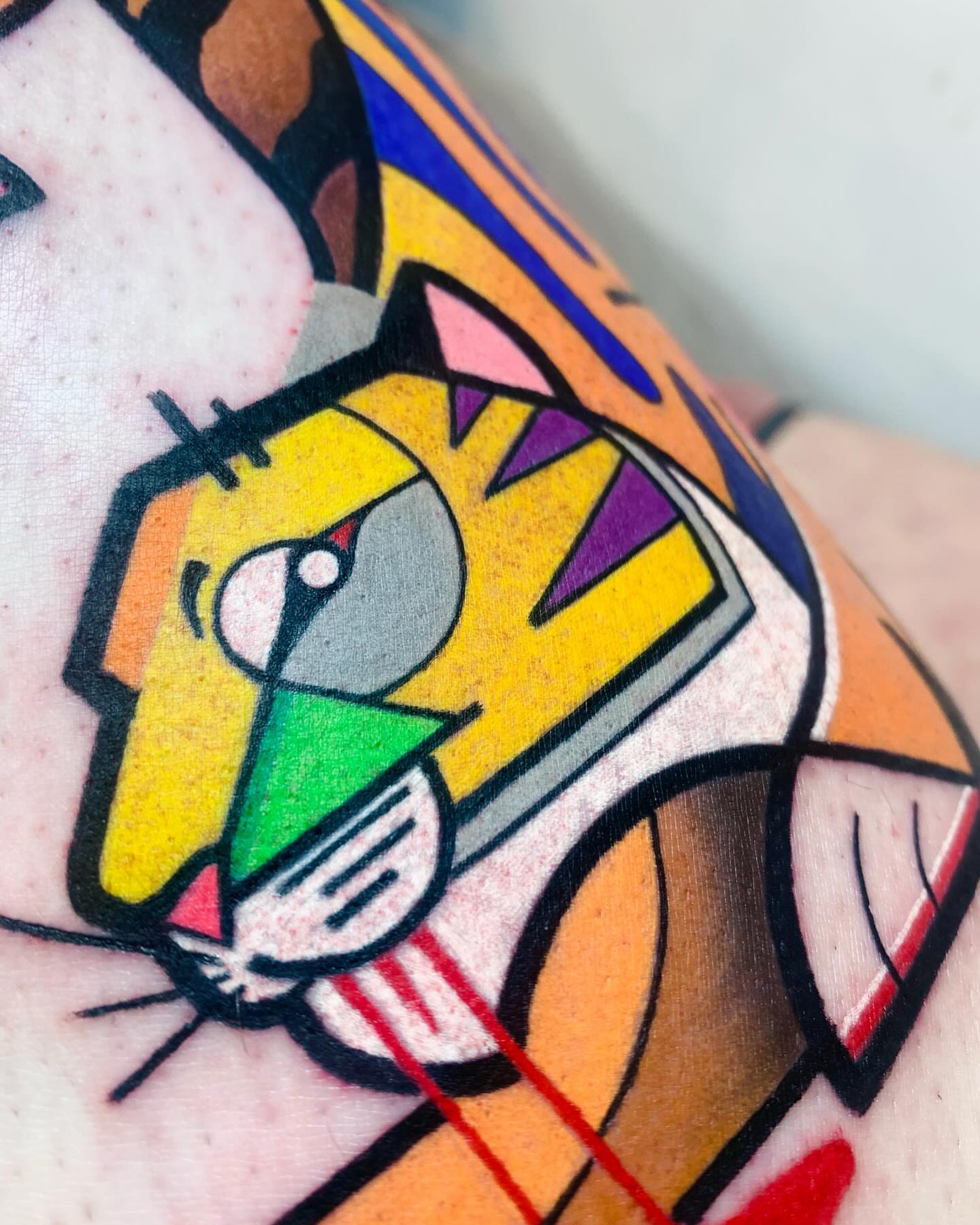 Cat geometric tattoo on the upper arm by hurjaesae