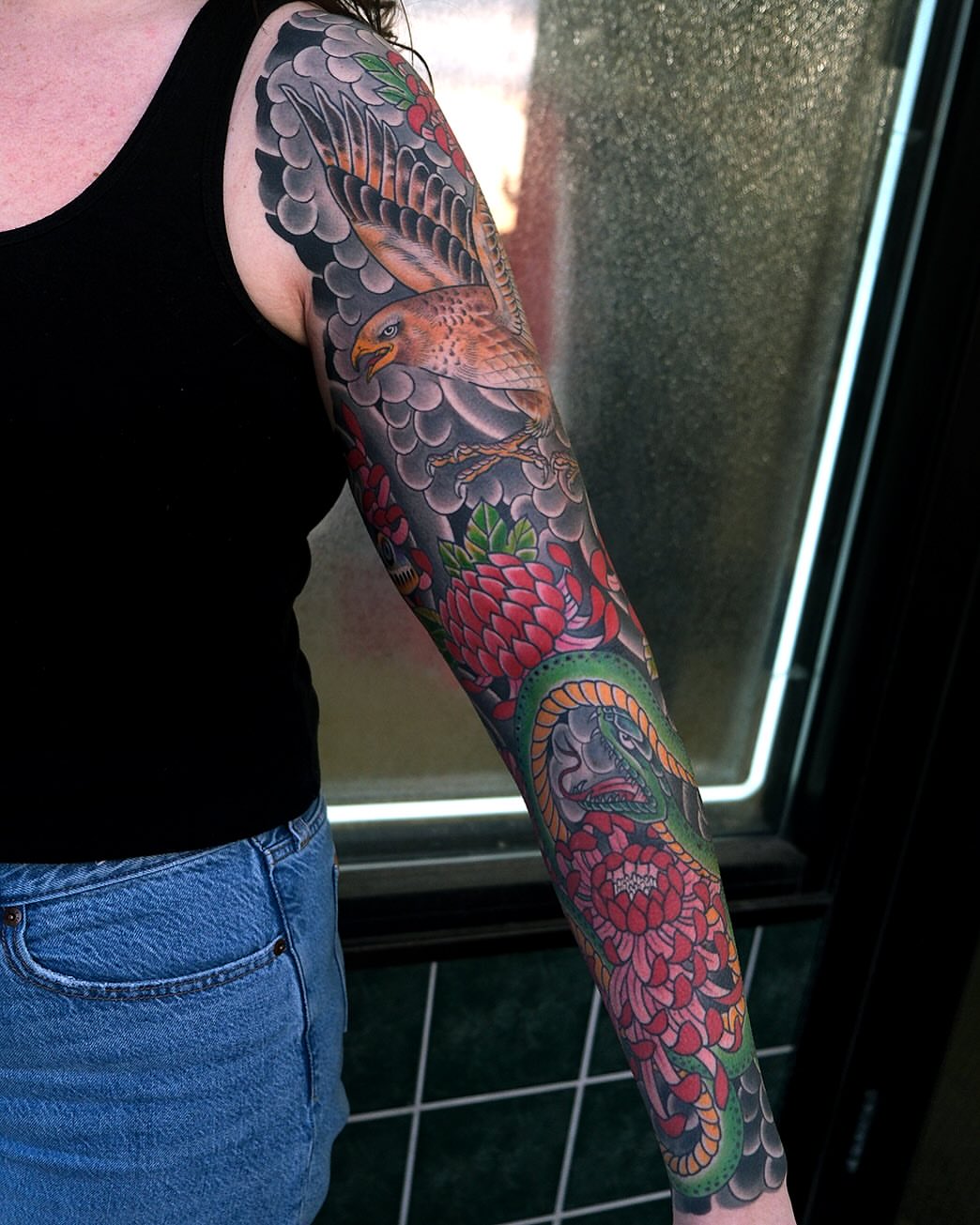 Hawk and floral japanese irezumi tattoo on the forearm by Erick Lynch, Cambridge, Massachusetts