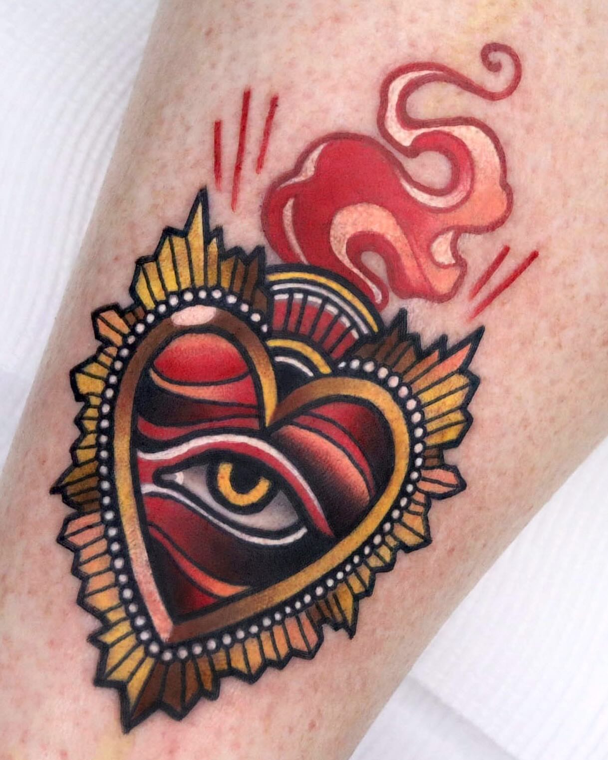 Heart with eye American traditional tattoo on the forearm by 부산타투