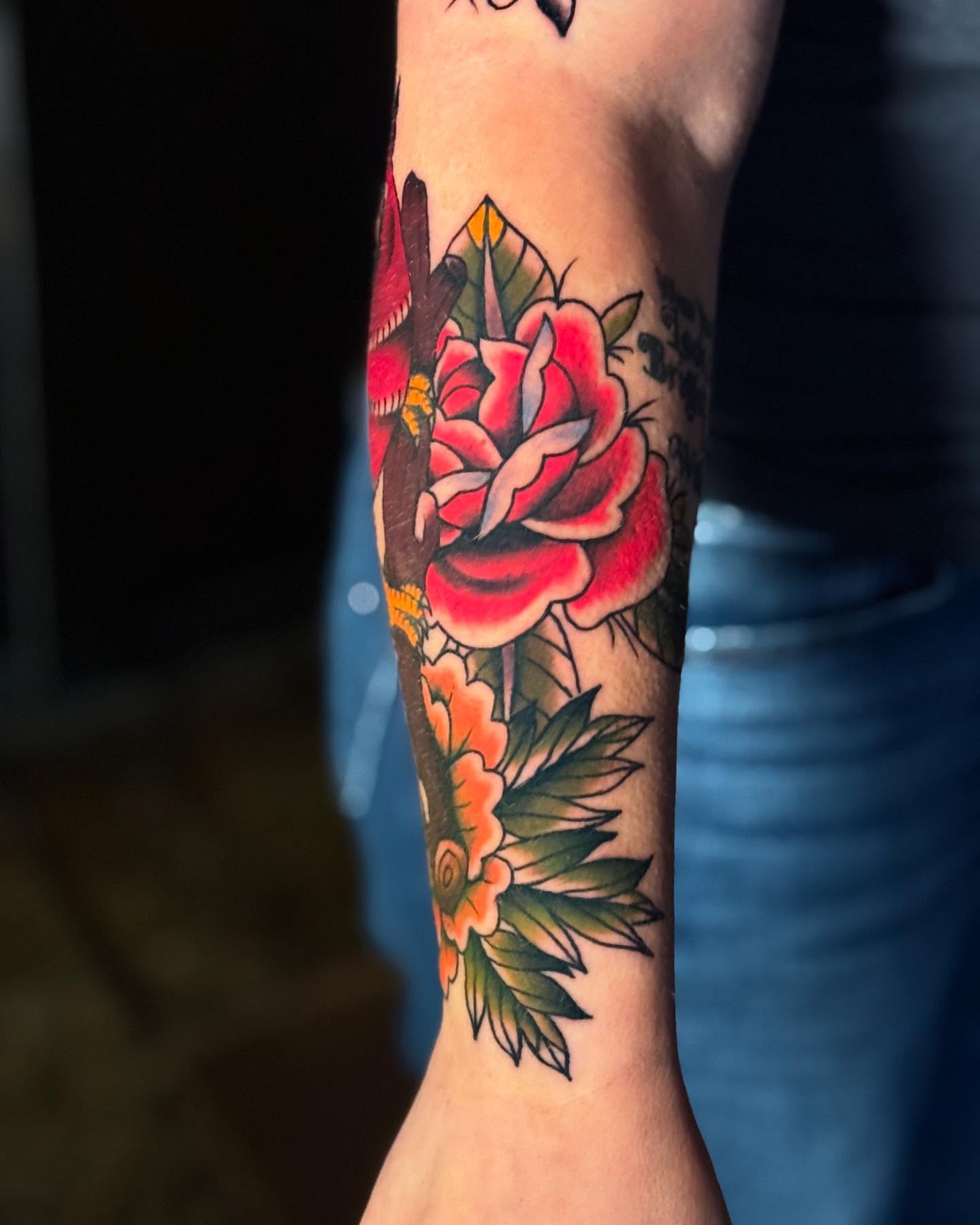 Flower bouquet American traditional tattoo on the forearm by Jeremy Carson