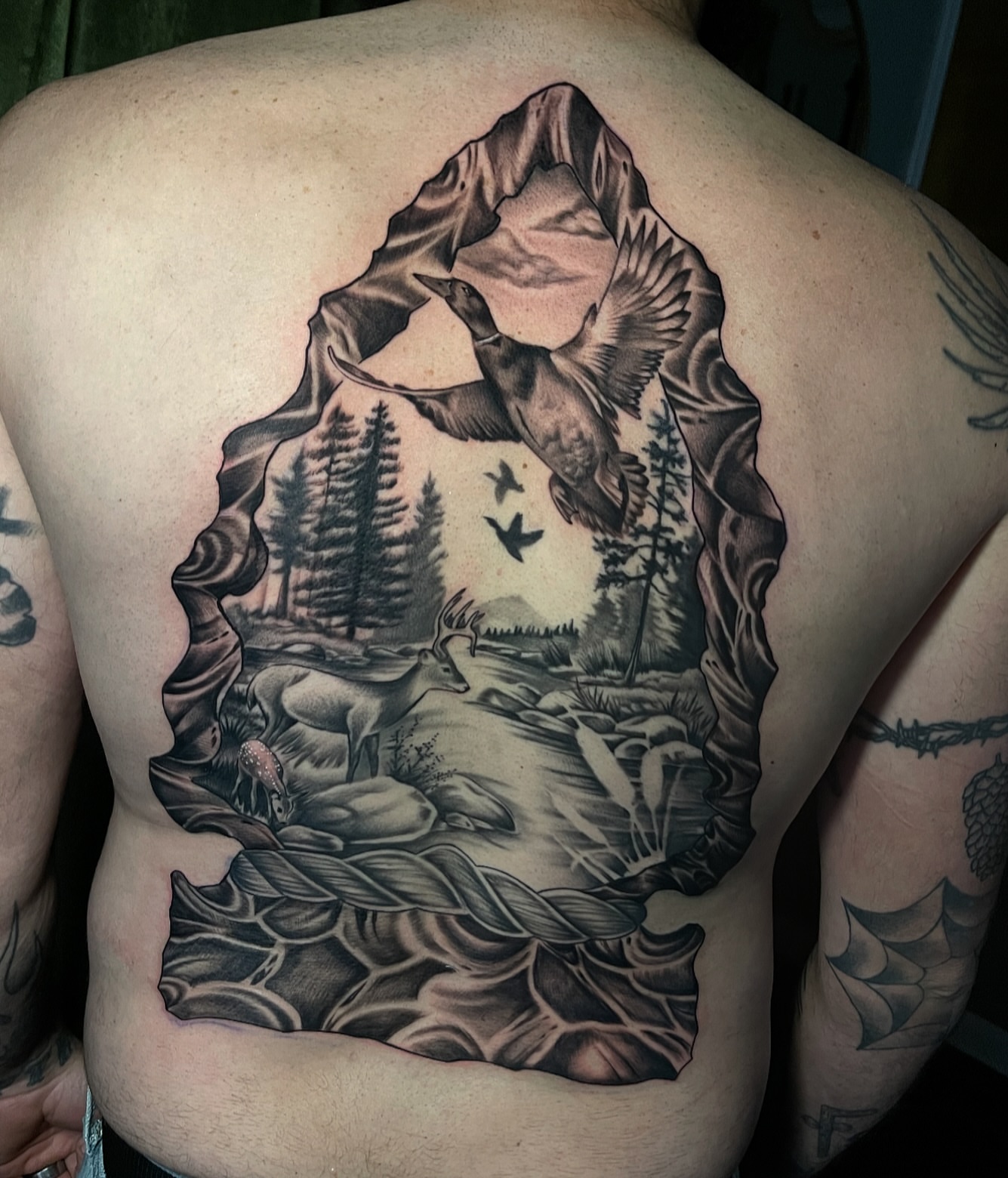 Landscape with wildlife realism tattoo on the back by Brittany Welsh, Marlton, New Jersey