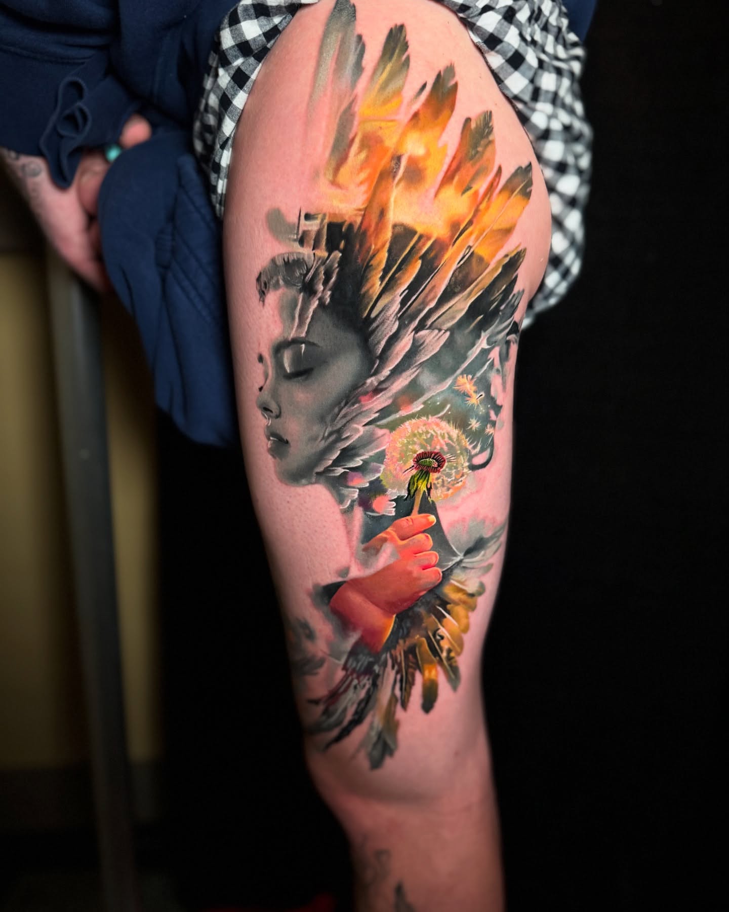 Woman with feathers and dandelion surrealism tattoo on the thigh by Justin Shelpman