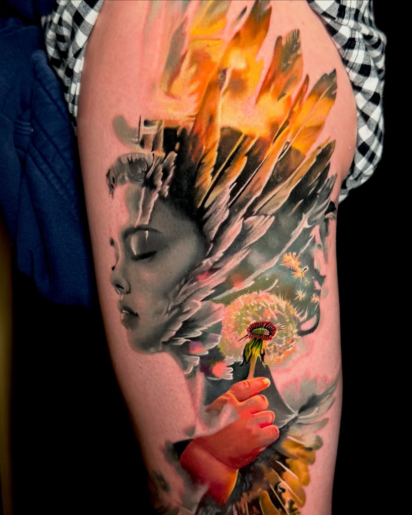 Woman with feathers and dandelion surrealism tattoo on the forearm by Justin Shelpman