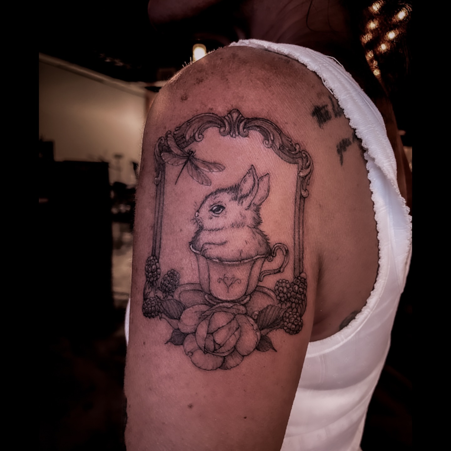Rabbit in teacup realism tattoo on the shoulder by 𝒥𝓊𝓃𝒾𝓅𝑒𝓇 𝒫𝑜𝓈𝓉 (Juju)