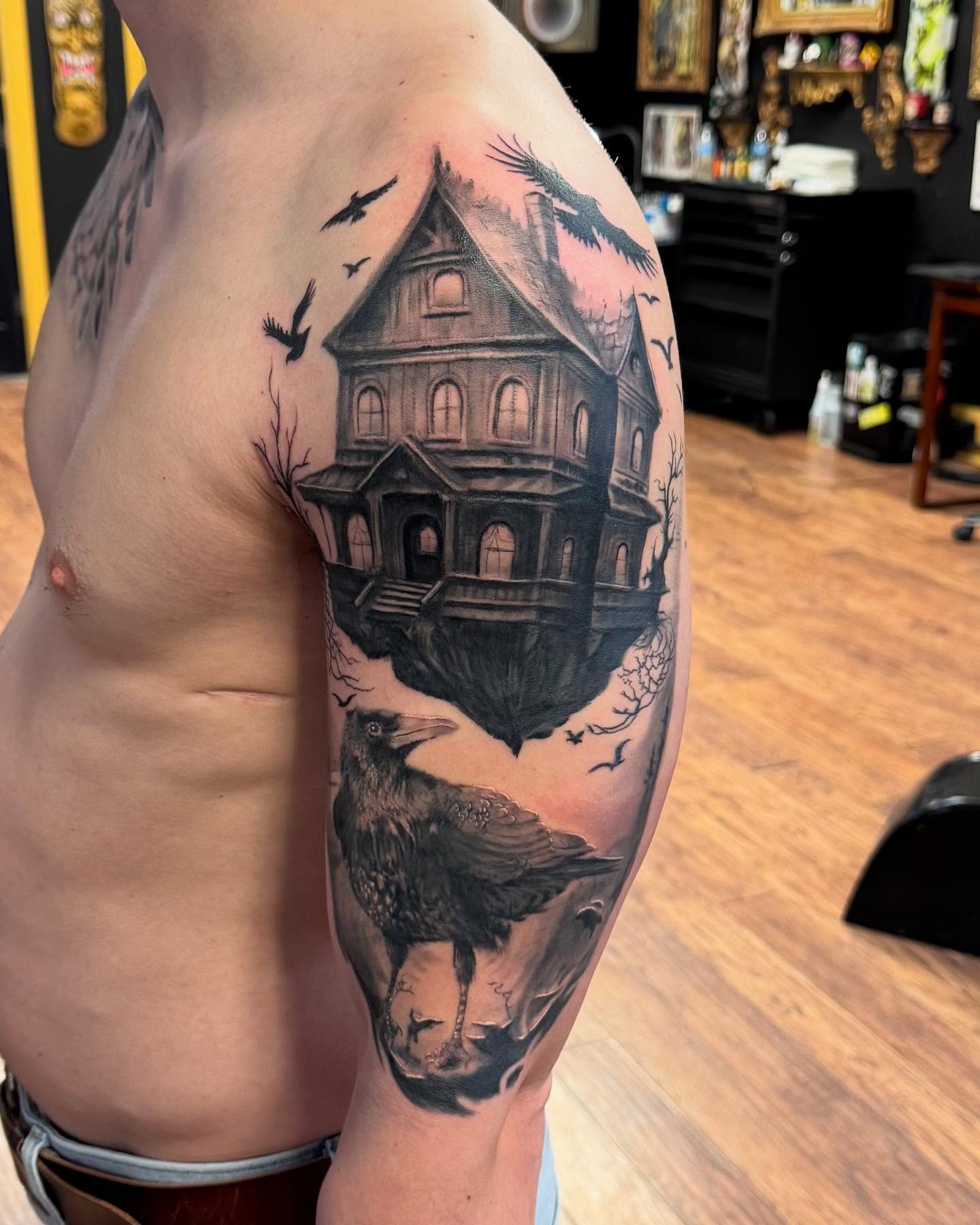 Haunted house realism tattoo on the shoulder by Kyle J. Bishop