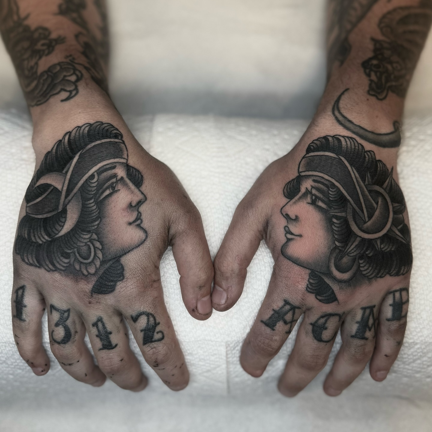 Woman's profile American traditional tattoo on the hand by Domanick Libretti, Nashville, Tennessee