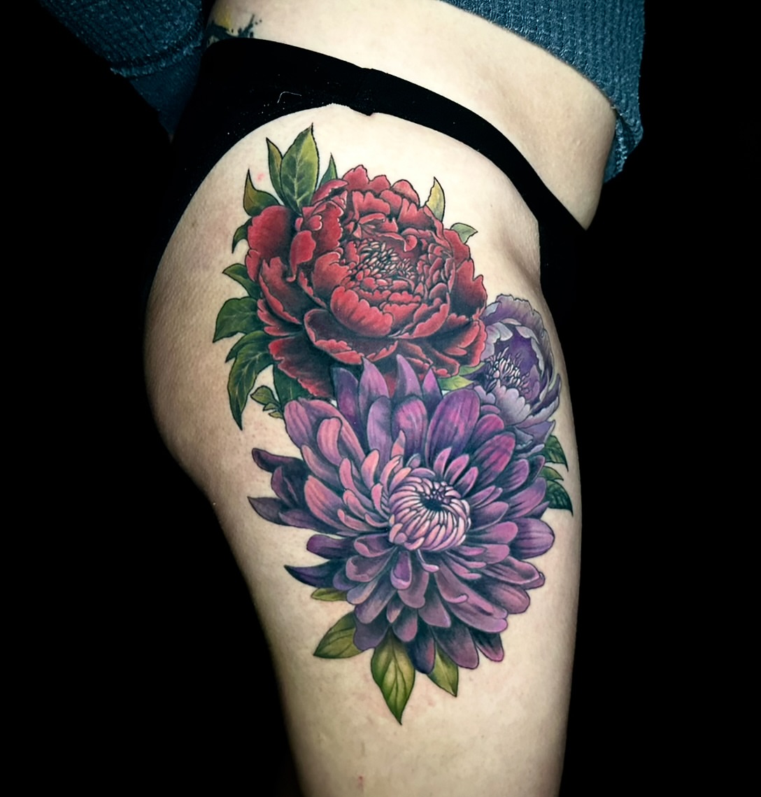 Floral bouquet realism tattoo on the thigh by Tyler Reep