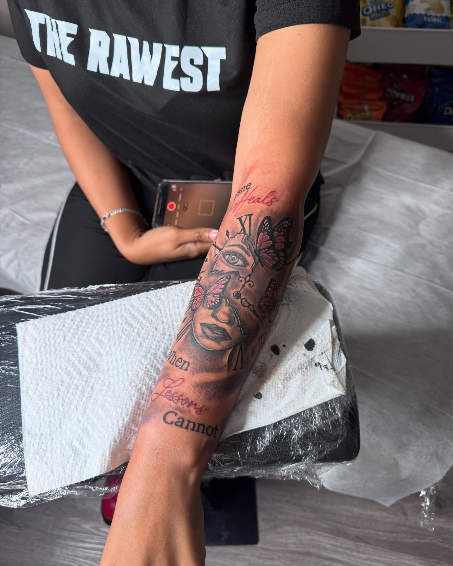 Woman's face with butterflies realism tattoo on the forearm by Sierra 🩷
