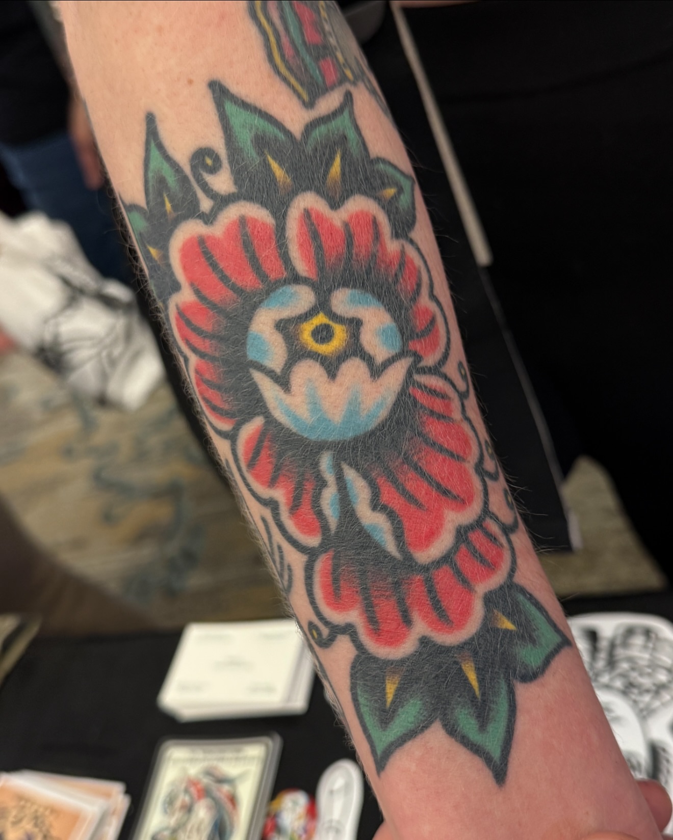 Floral design American traditional tattoo on the forearm by Cullen Bleser Quinn