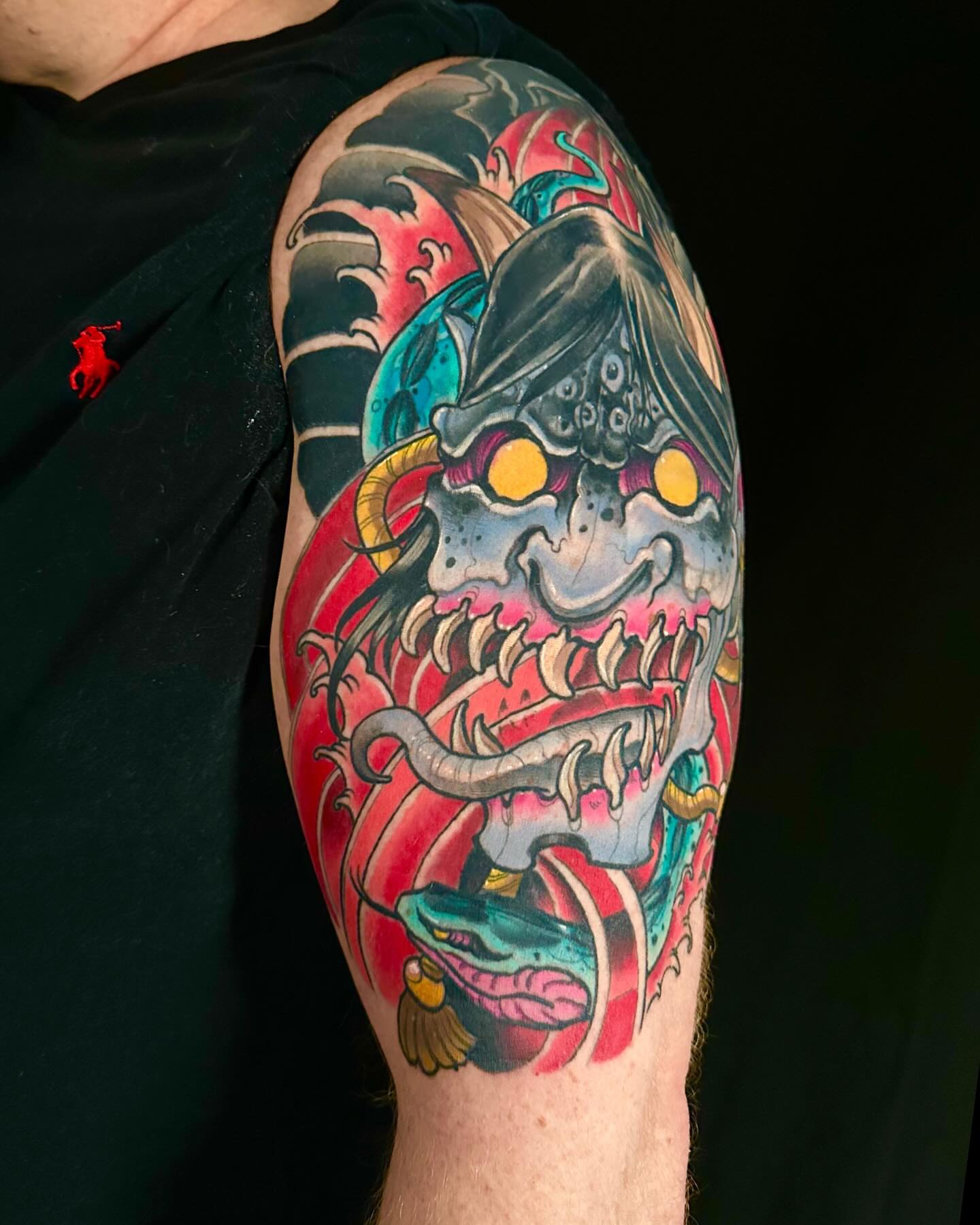 Demon mask American traditional tattoo on the forearm by John Milosh Chamberlin