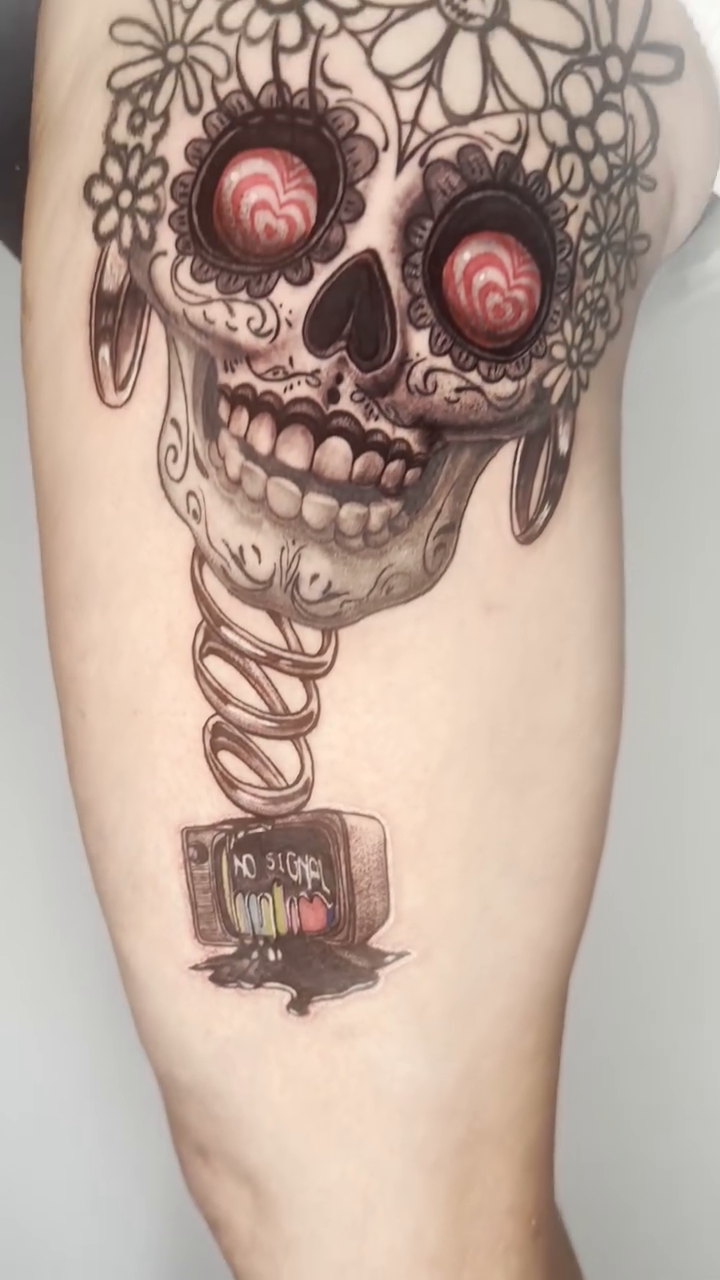Jack-in-the-box skull with TV realism tattoo by Adrian Dominguez, Las Vegas, Nevada