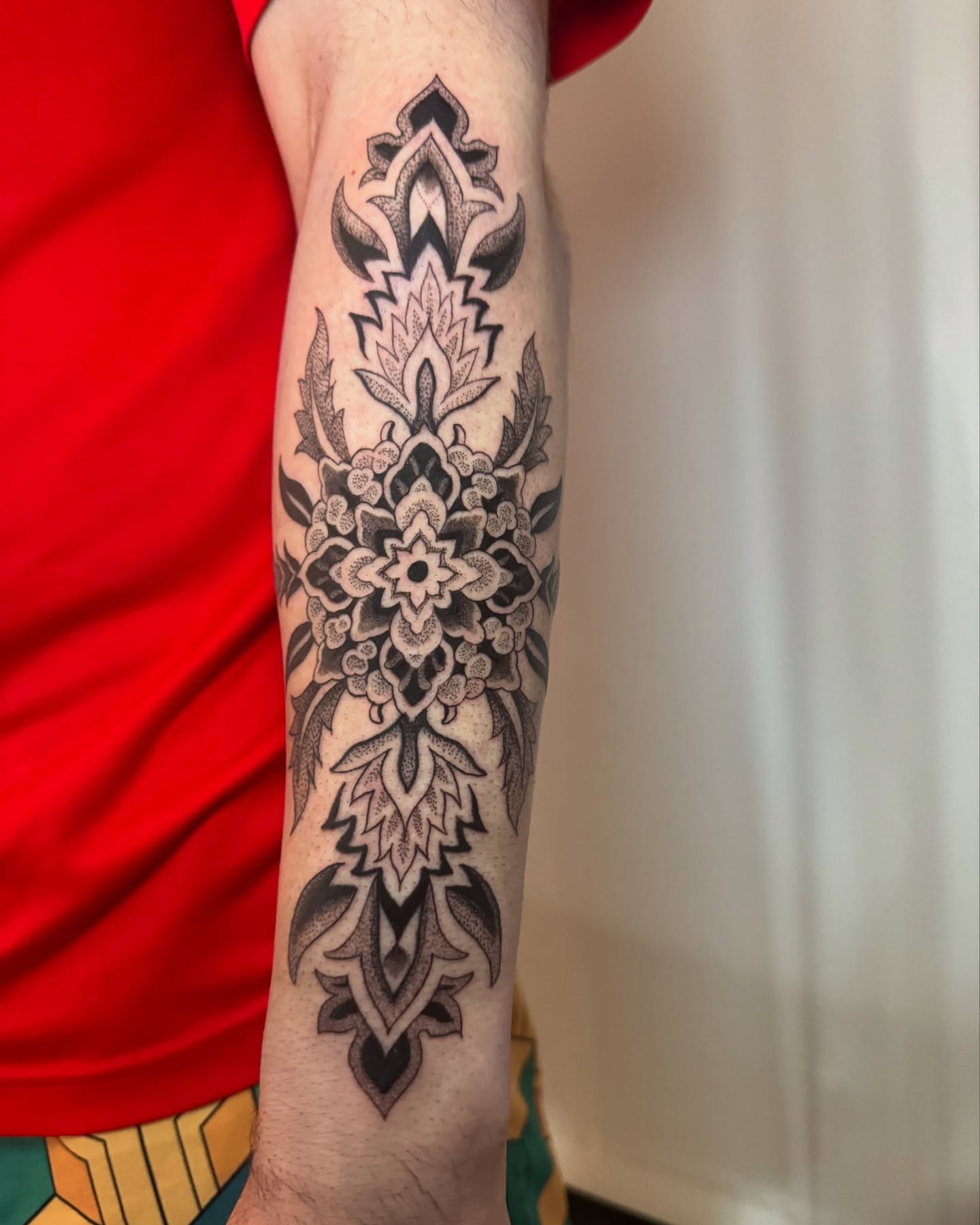 Floral mandala dotwork tattoo on the forearm by Erick Mendivil