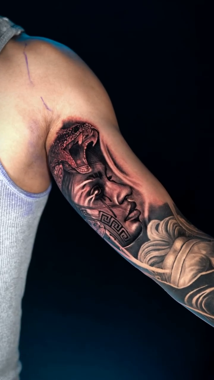 Serpent and face realism tattoo by Ricardo javier Gil, Dallas, Texas