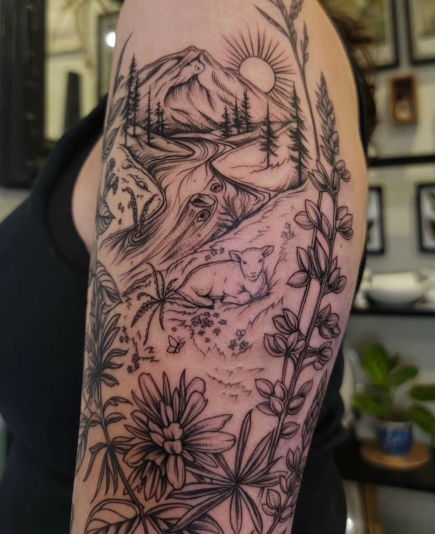 Mountain landscape black and grey tattoo on the forearm by Sierra (cc) Klein