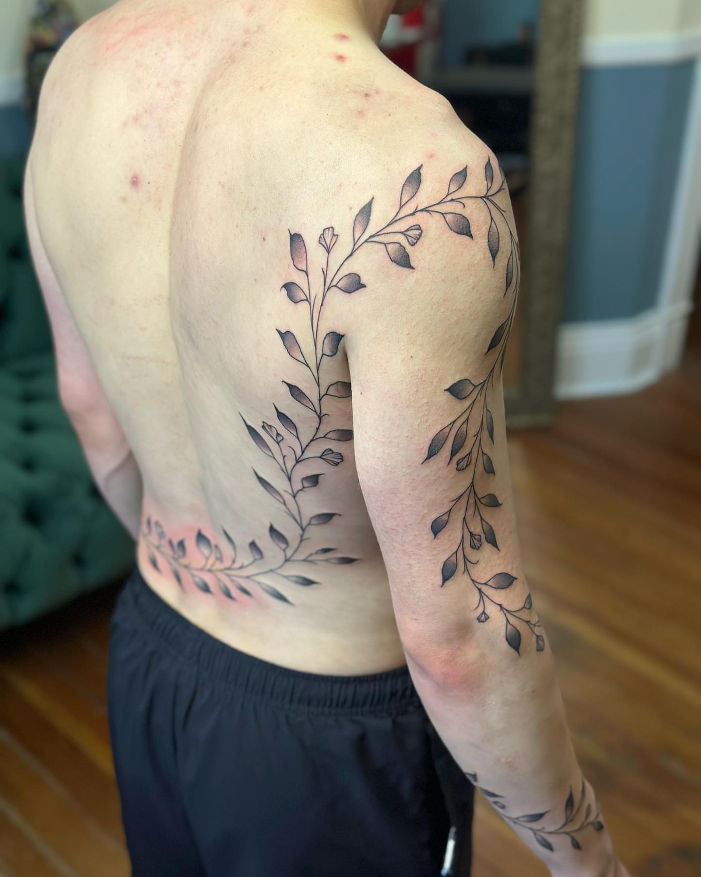 Branch with leaves black and grey tattoo on the shoulder by SAL, Mesa, Arizona