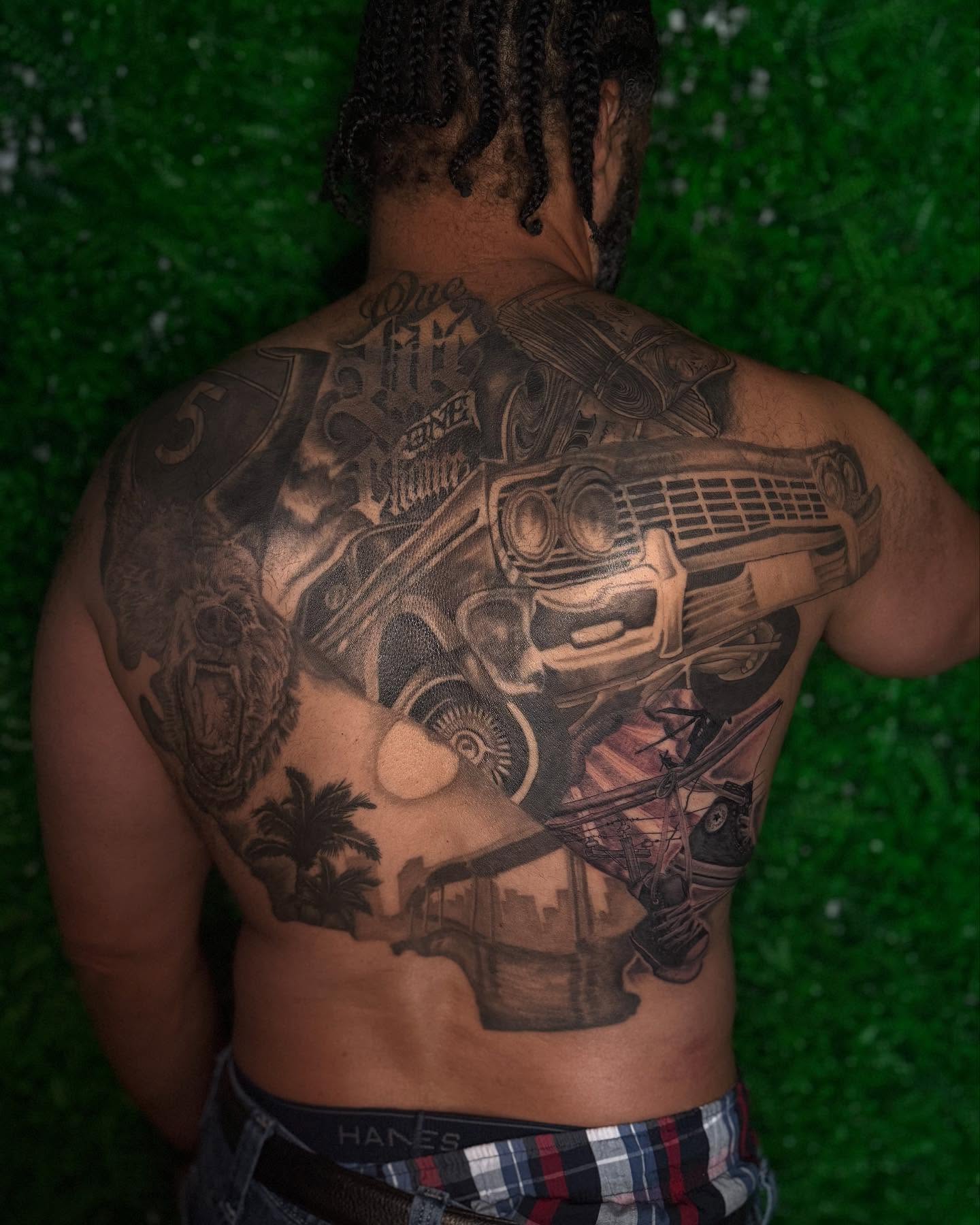 Car and palm trees realism tattoo on the back by Los Angeles Tattoo Artist
