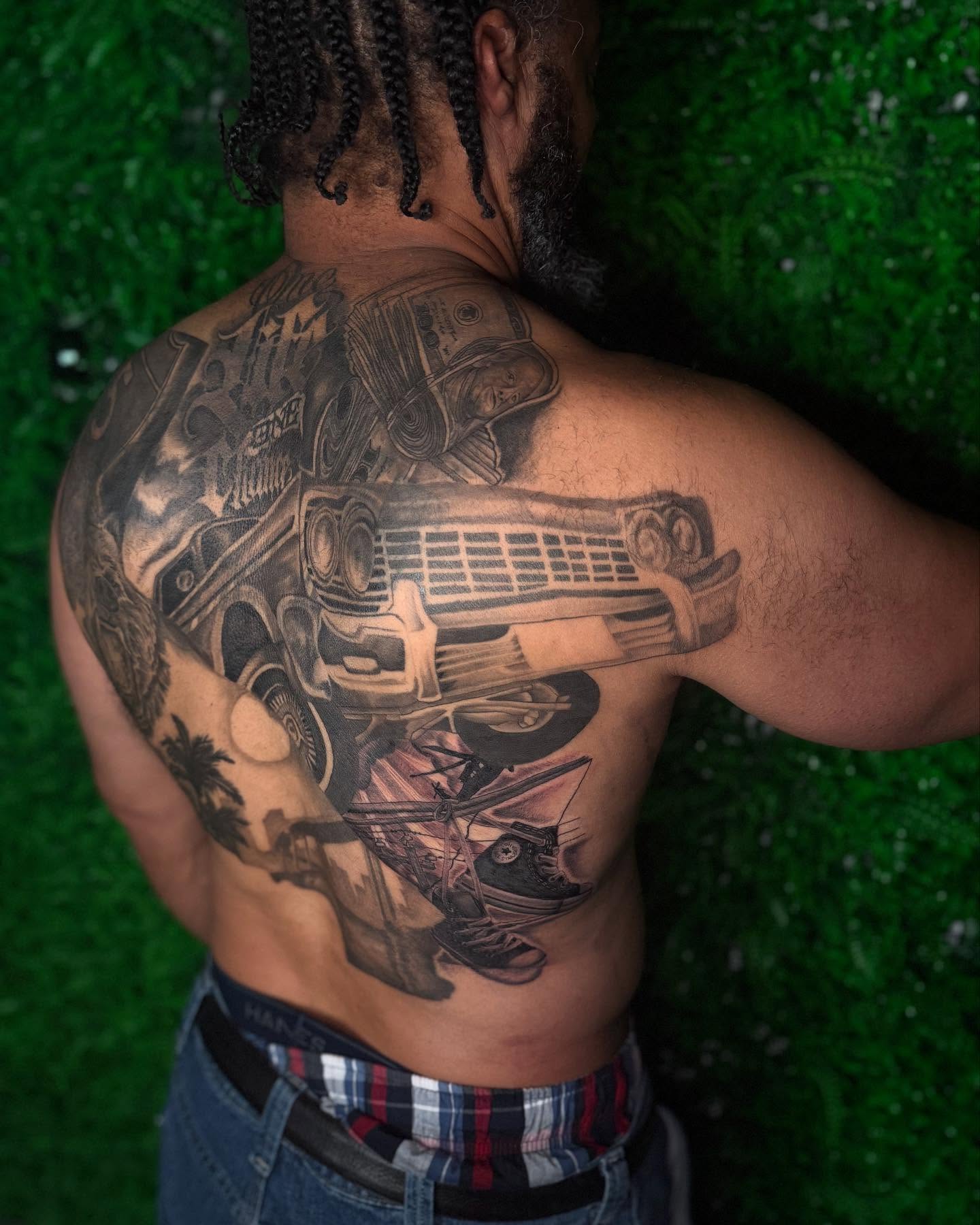 Car black and grey tattoo on the back by Los Angeles Tattoo Artist