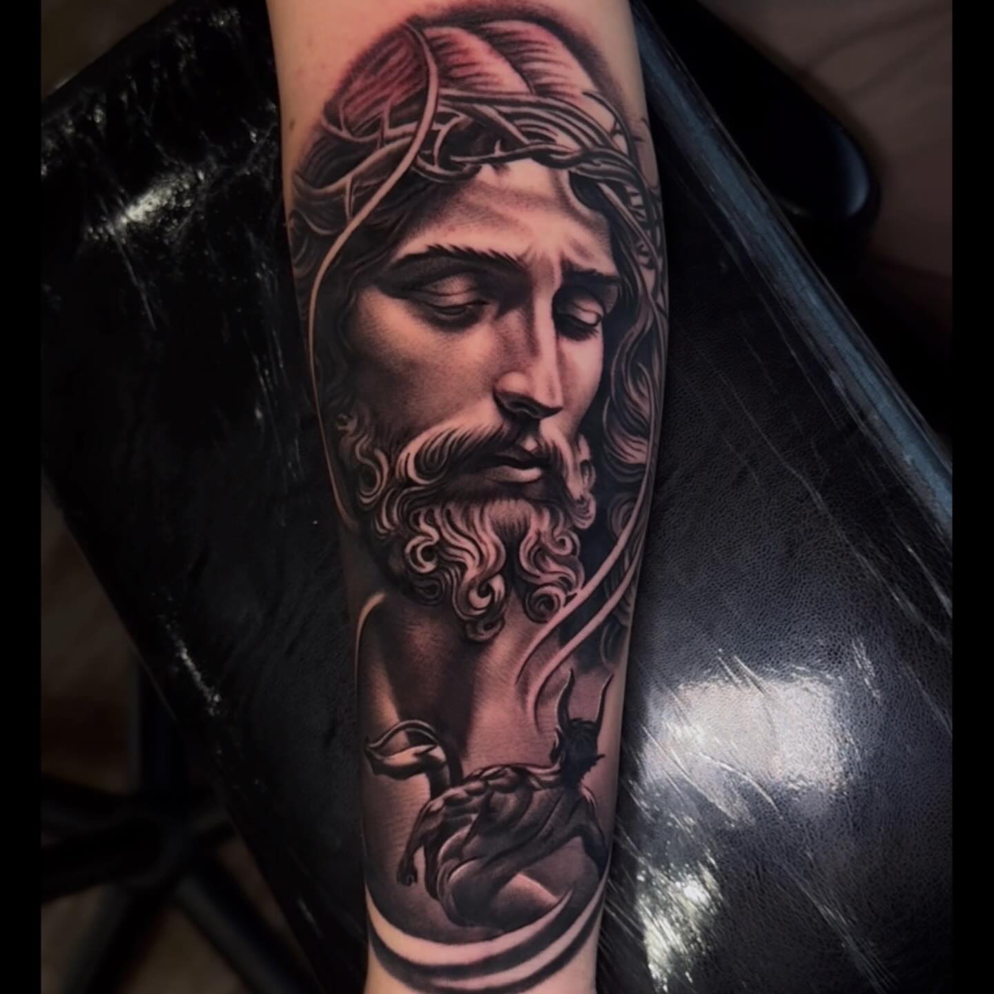 Religious figure realism tattoo on the forearm by Jose Mendoza Torres