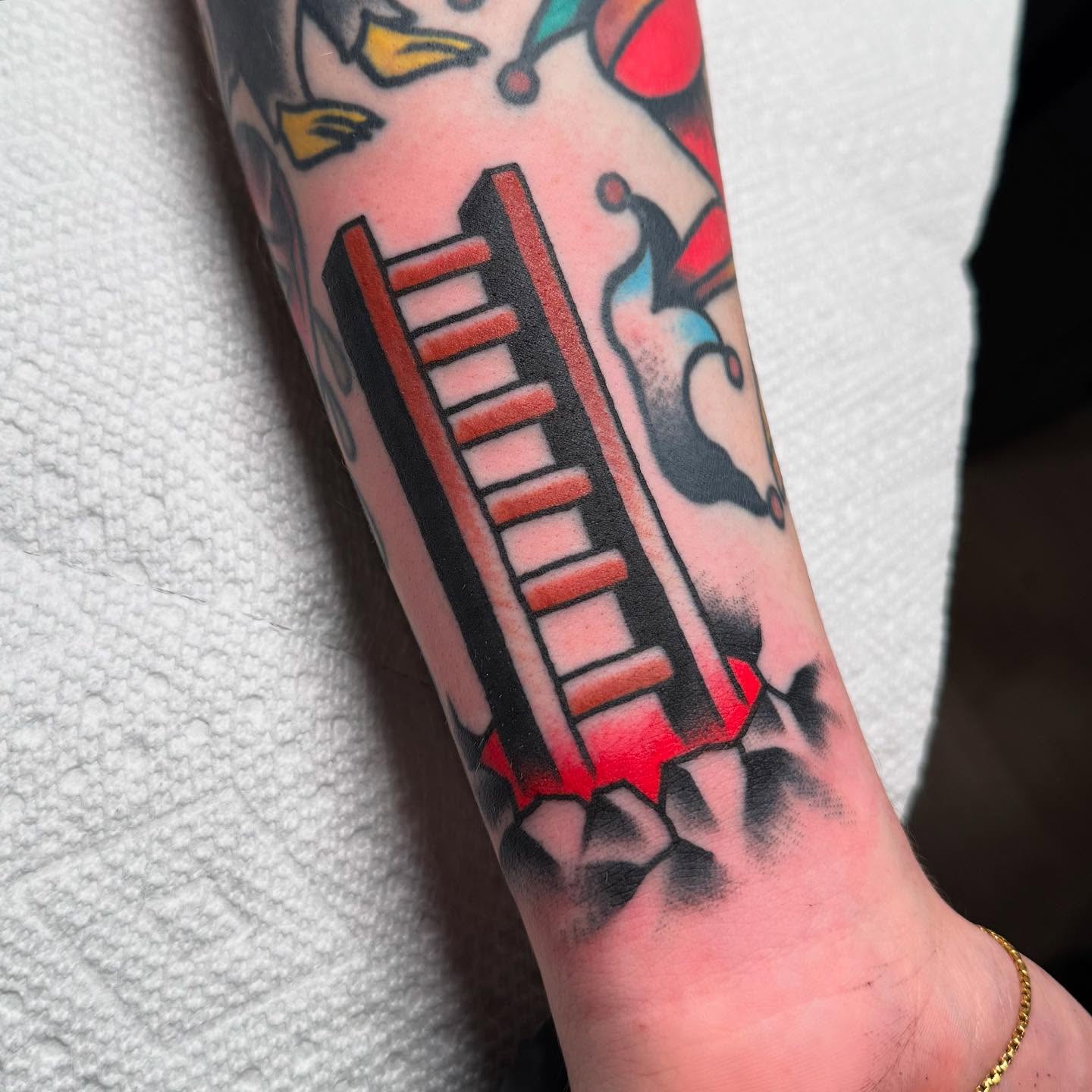 Keyboard American traditional tattoo on the forearm by Zach Roman, Madison, Wisconsin