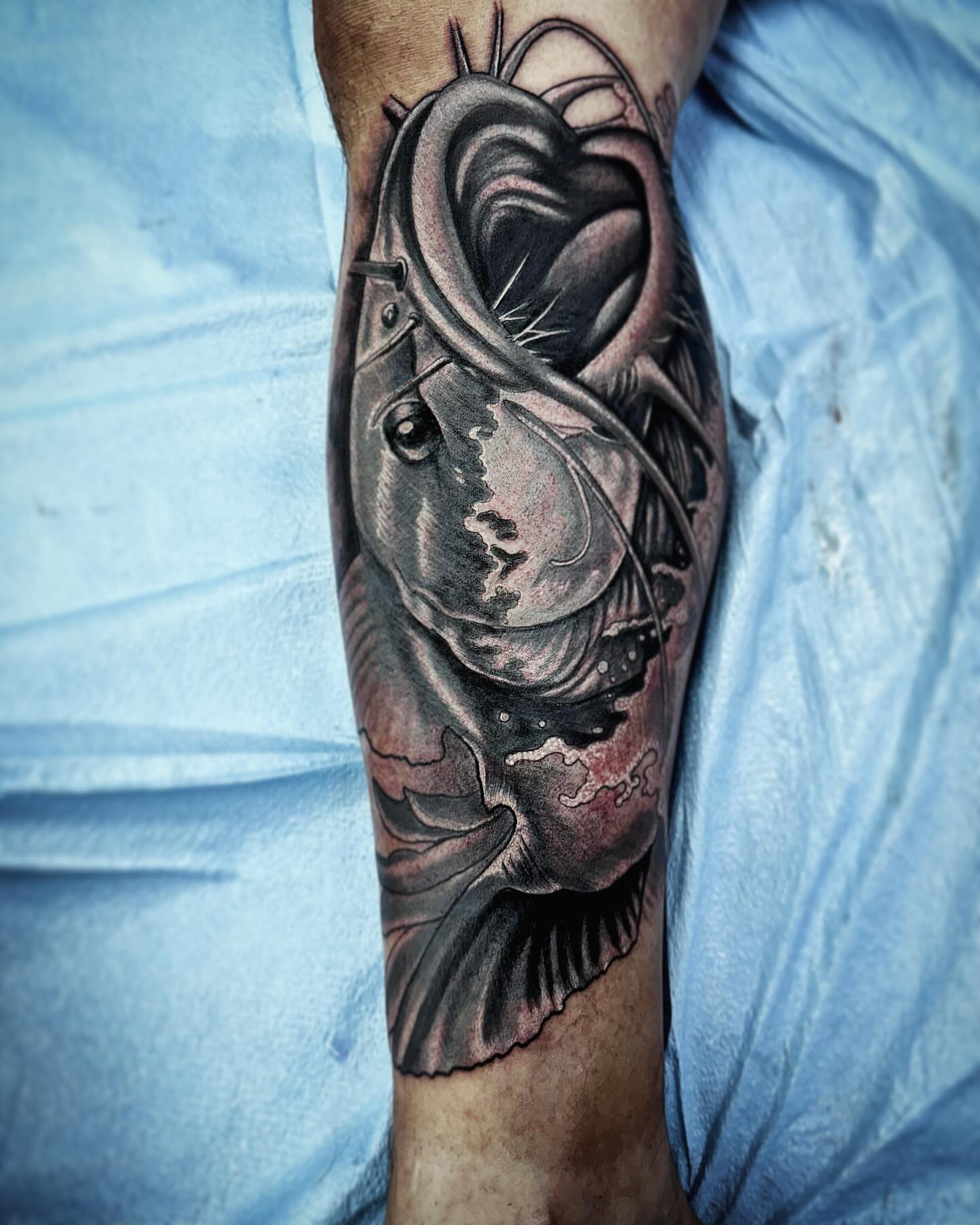 Fish realism tattoo on the forearm by Labbé