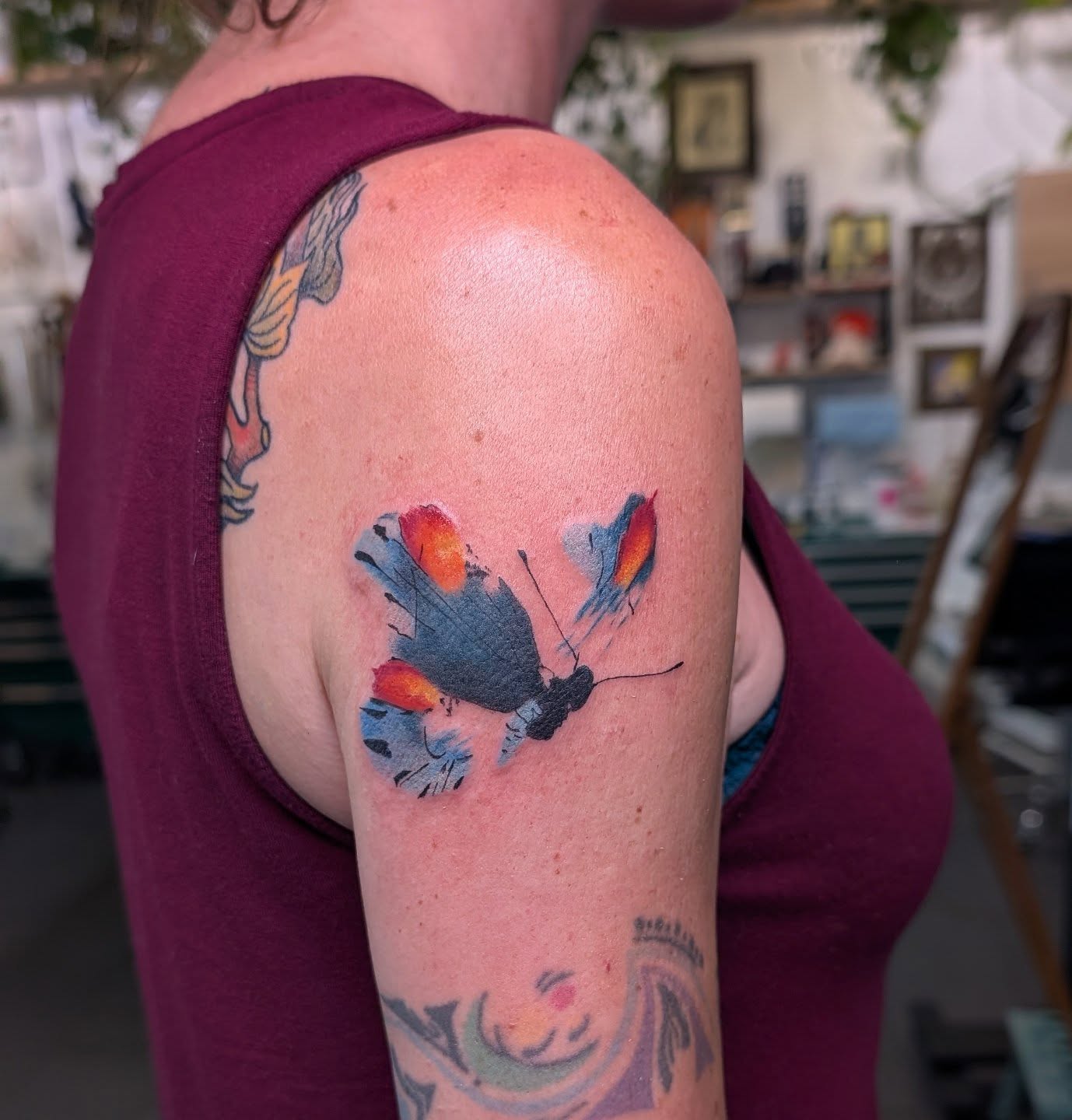 Butterfly watercolor tattoo on the shoulder by Jhenn