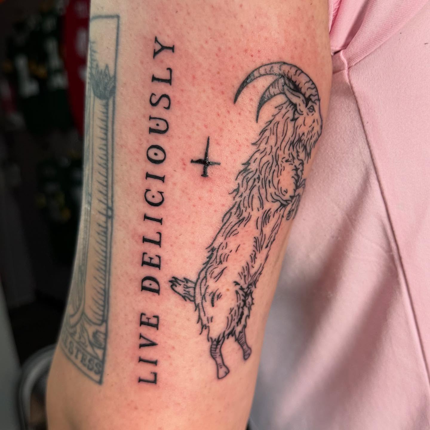 Ram and text black and grey tattoo on the forearm by Hunter Beyer