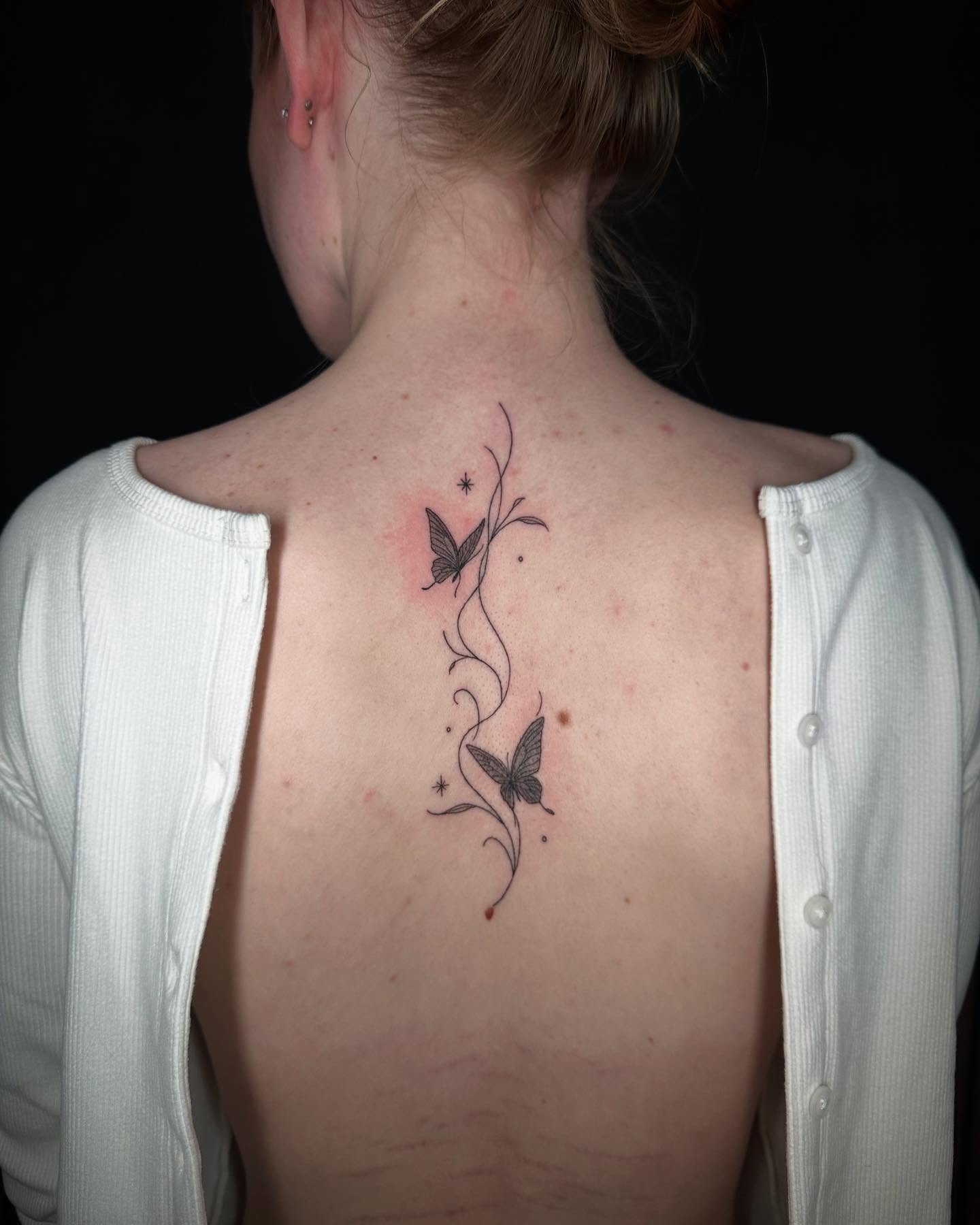 Butterflies black and grey tattoo on the back by Felipe Pacifico