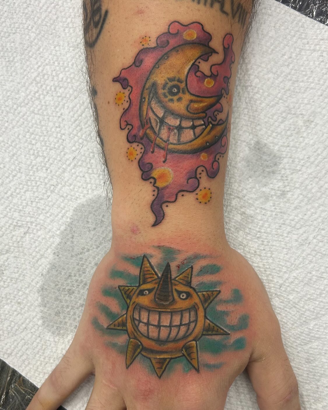 Sun and moon American traditional tattoo on the hand by ⚡️Shaw⚡️