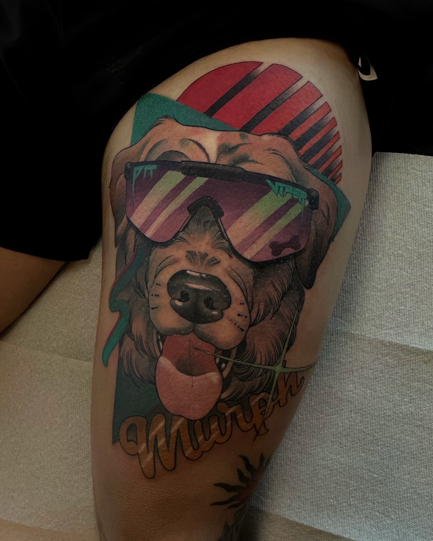 Dog wearing sunglasses realism tattoo on the thigh by Anne Cornelson