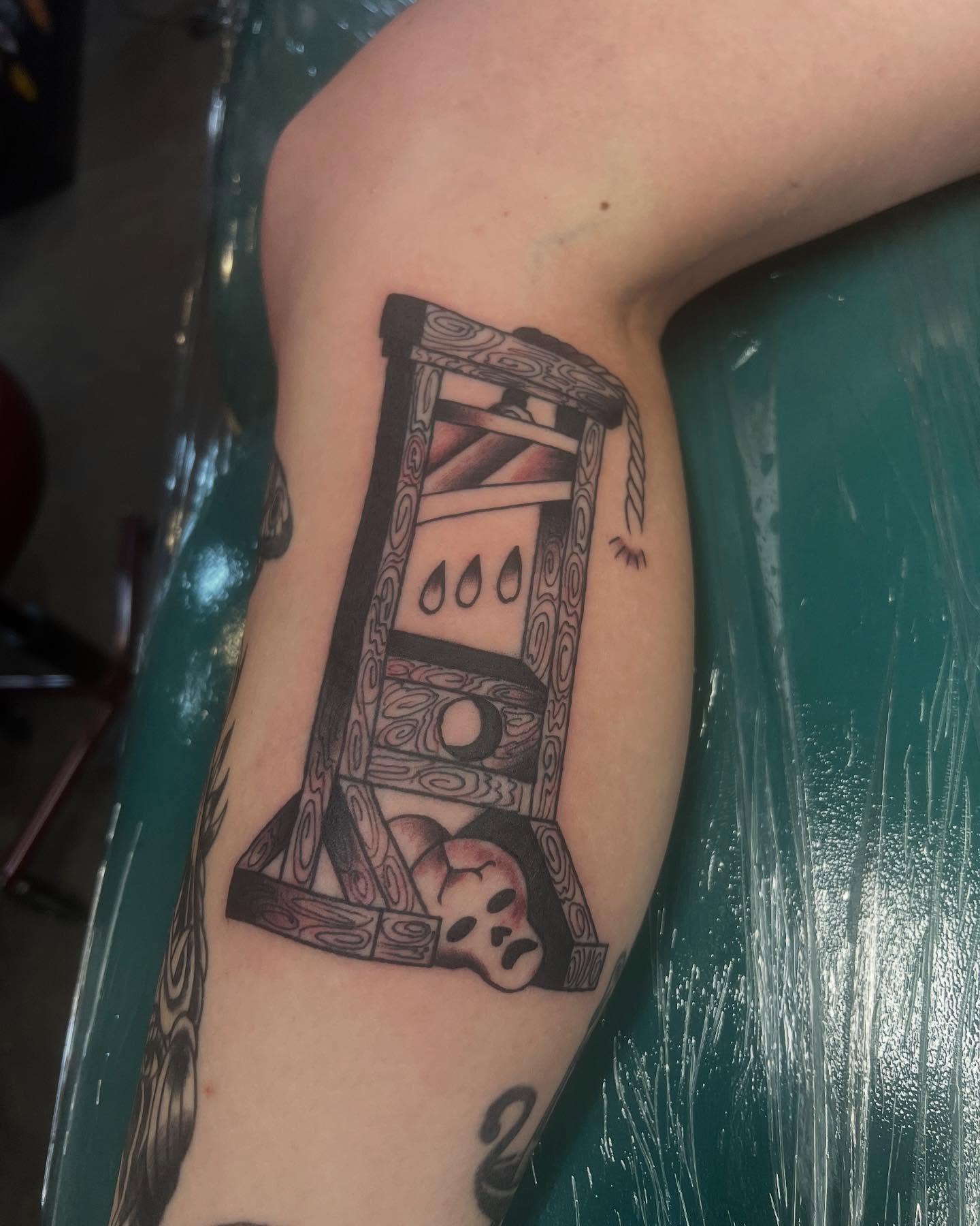 Skull and ladder black and grey tattoo on the forearm by Mika Clairissa