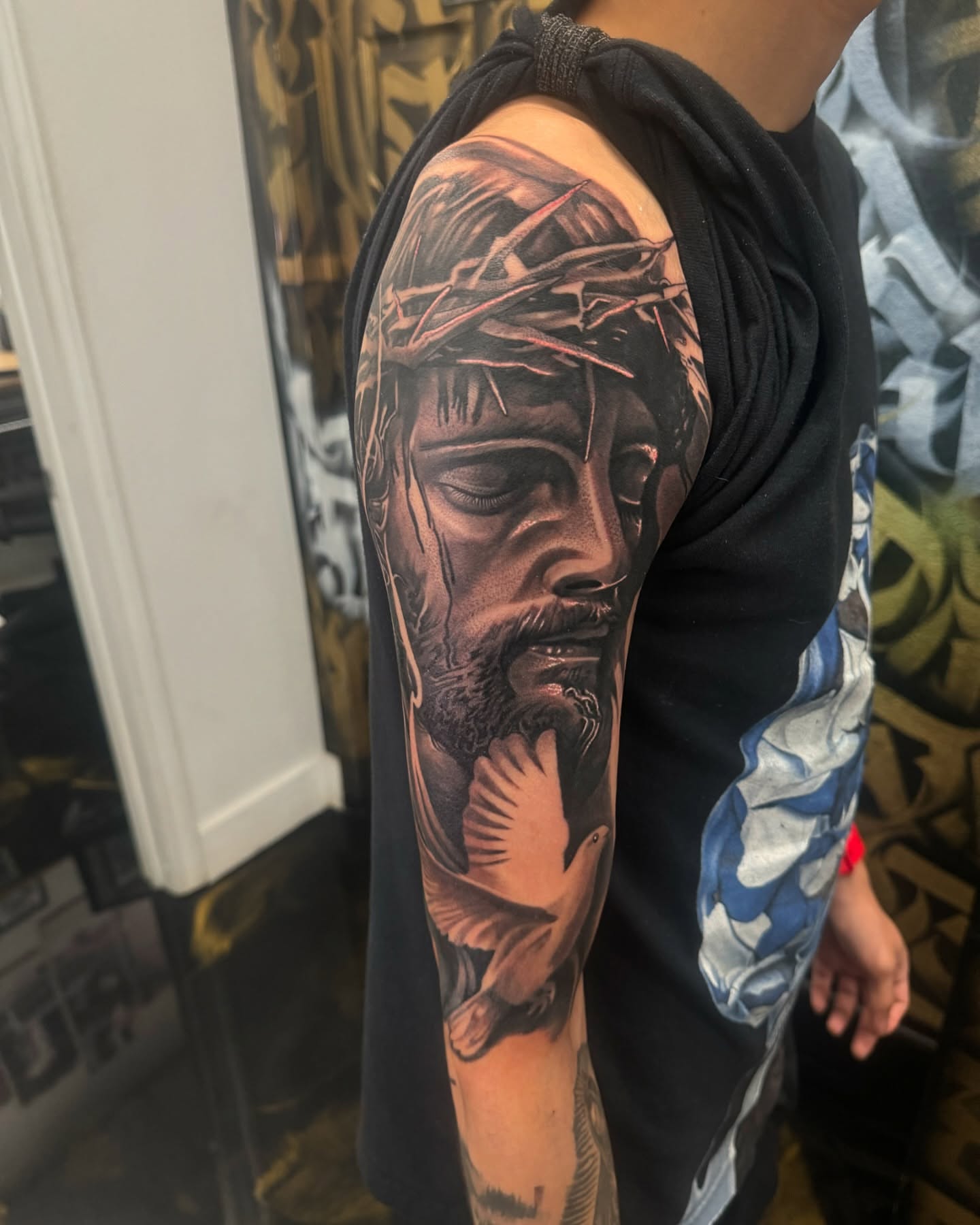 Religious figure realism tattoo on the forearm by Fernando Luna