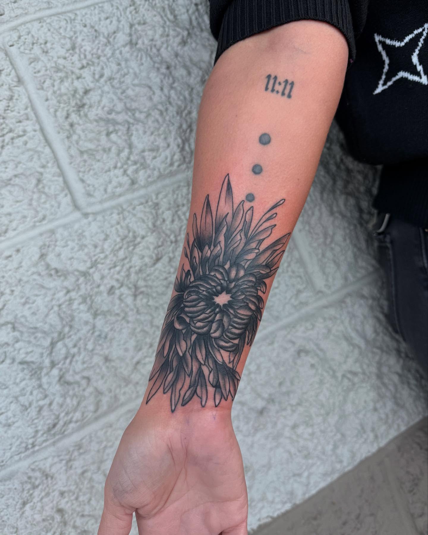 Sunflower black and grey tattoo on the forearm by Kylee langford 🧿