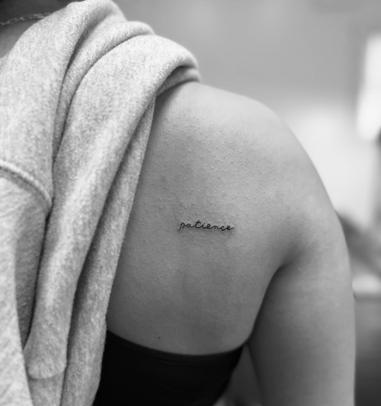 Patience lettering script tattoo on the shoulder by Kylee Snow