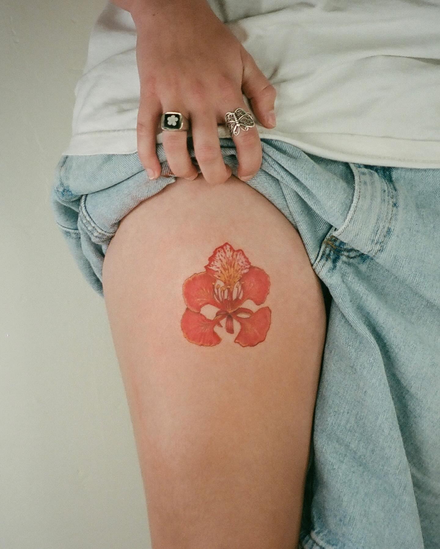 Red flower watercolor tattoo on the thigh by β±βΏβ° π π π° π πΎ β±βΏβ°