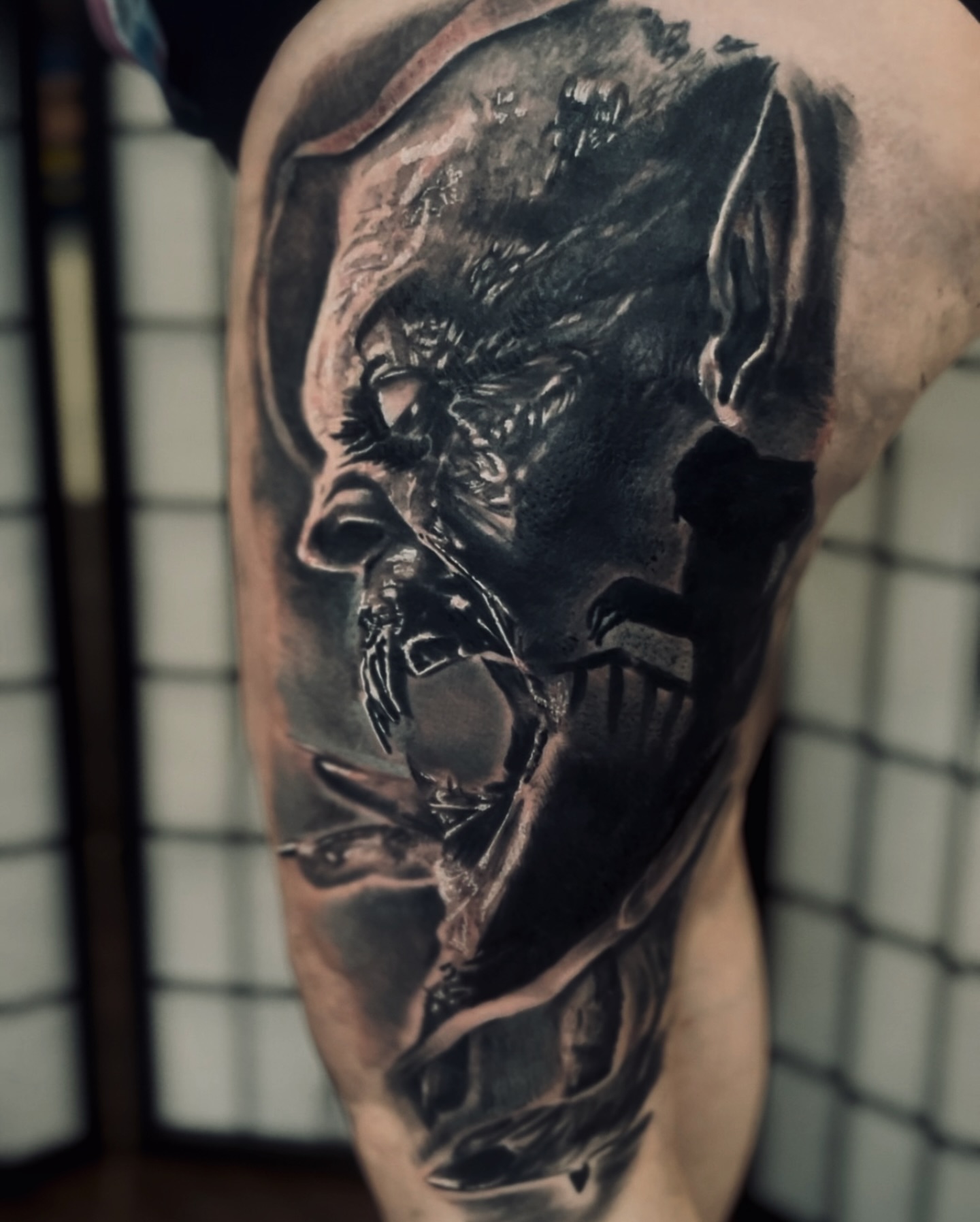 Man's face realism tattoo on the forearm by C.J. Rued