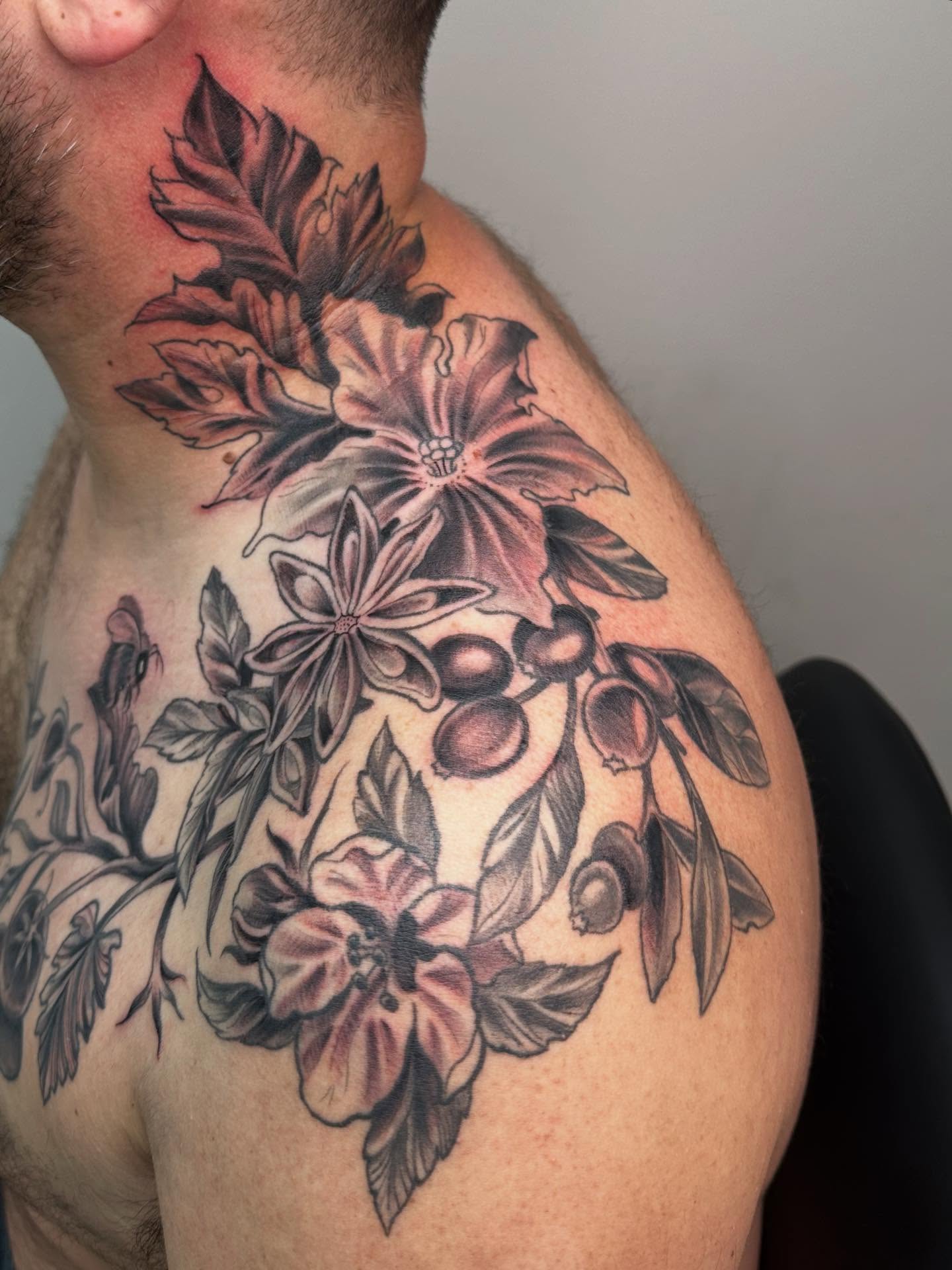 Floral arrangement realism tattoo on the shoulder by Heather Tattoos Danvers MA