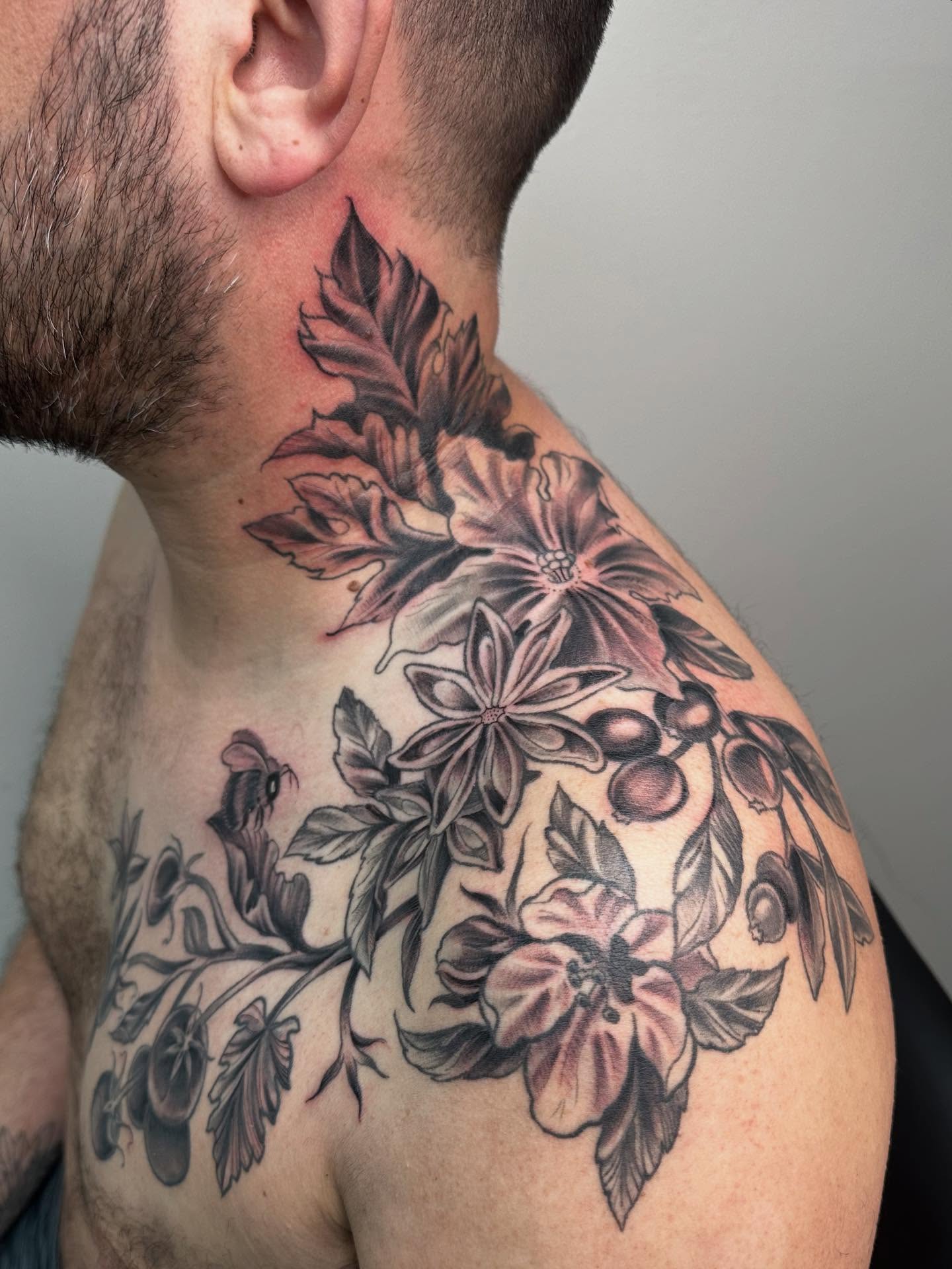 Floral arrangement black and grey tattoo on the shoulder by Heather Tattoos Danvers MA