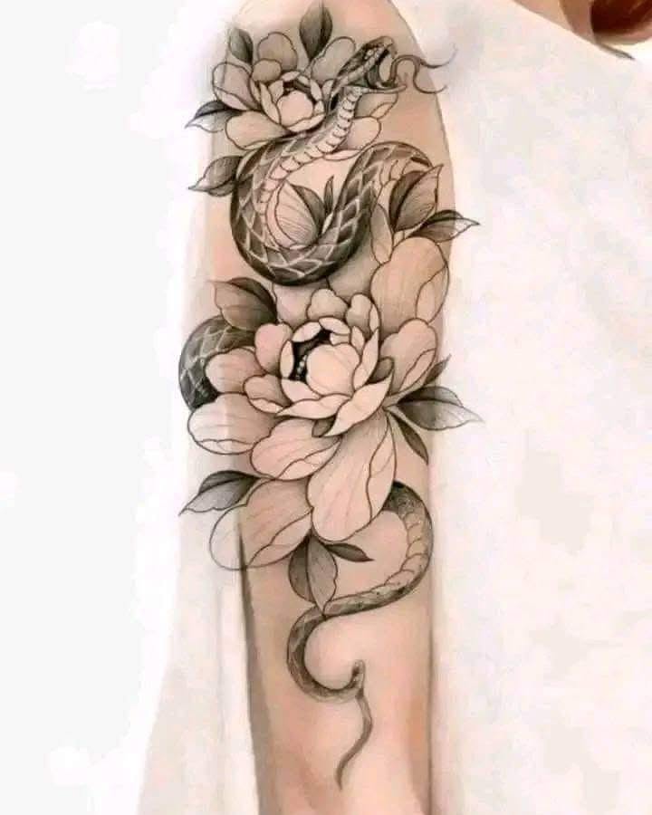 Snake and peony black and grey tattoo on the forearm by Aj Negrete Jr.