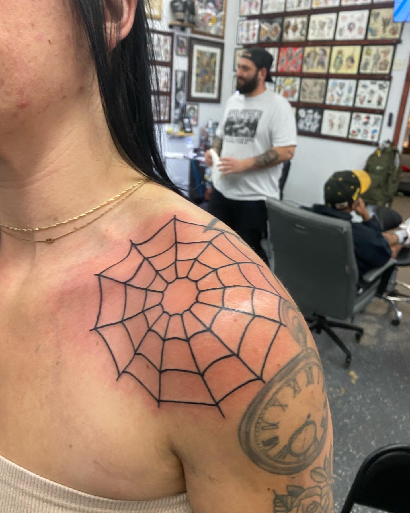 Spider web geometric tattoo on the shoulder by Payton Prentice